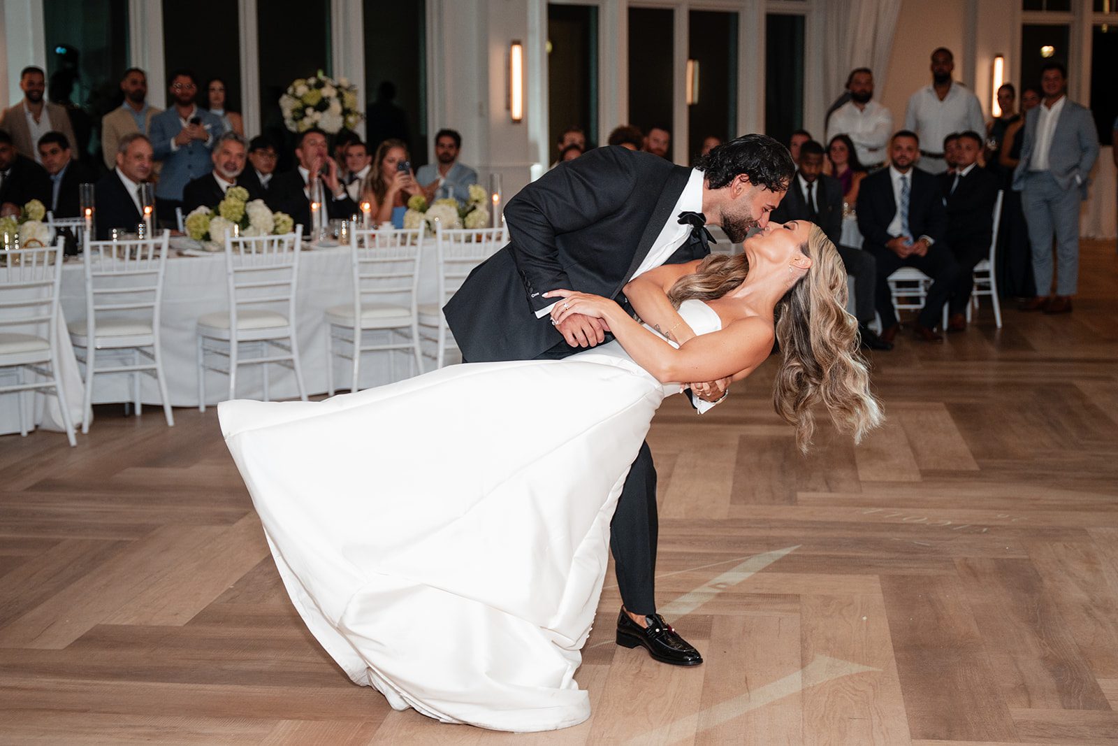 Groom dipping the bride on the dance floor
