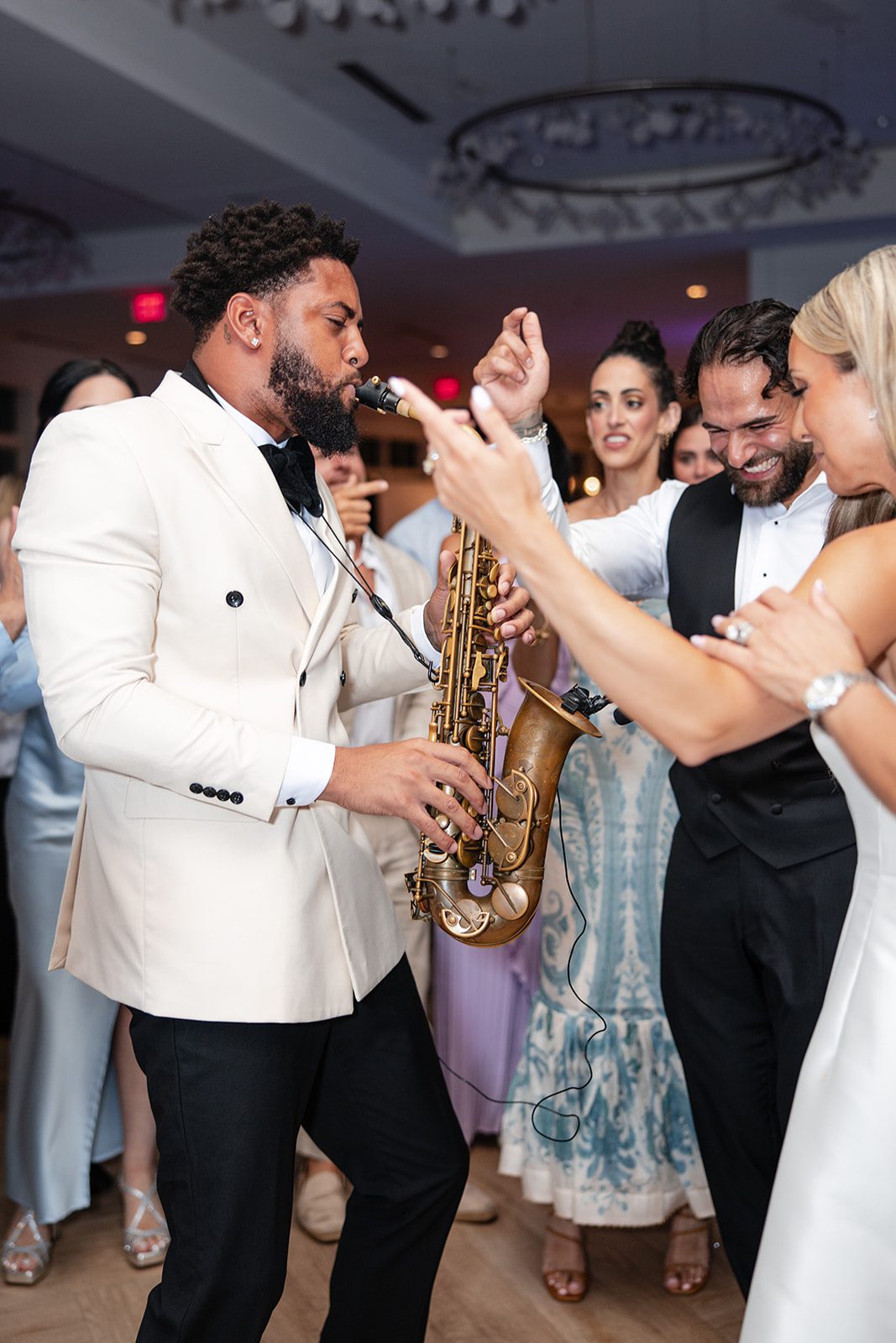 Saxophone player with guests on the dance floor at The Wychmere