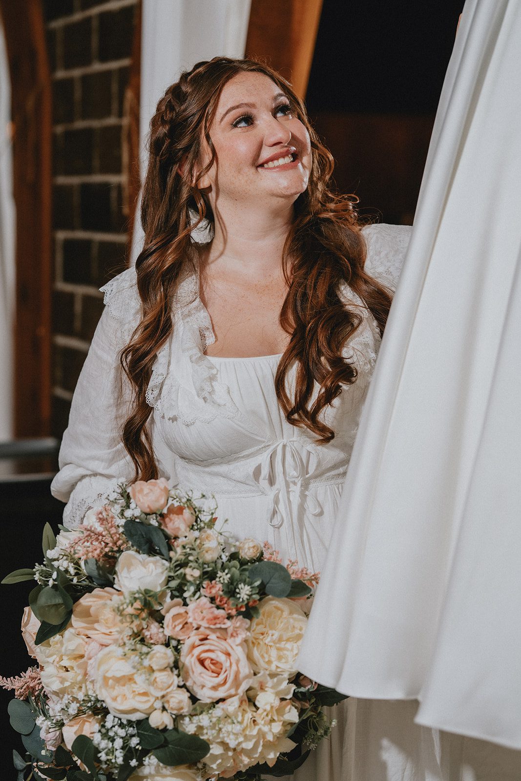 Bride getting into her wedding dress