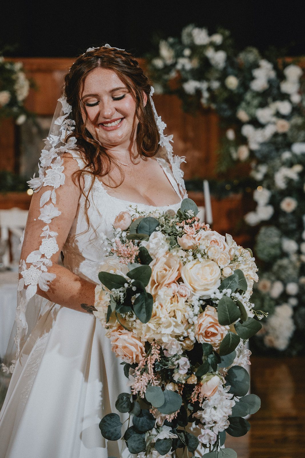 Bride posing with her bouquet at The Z Hall