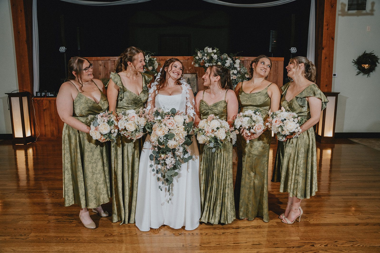 Bride with her bridesmaids in sage green