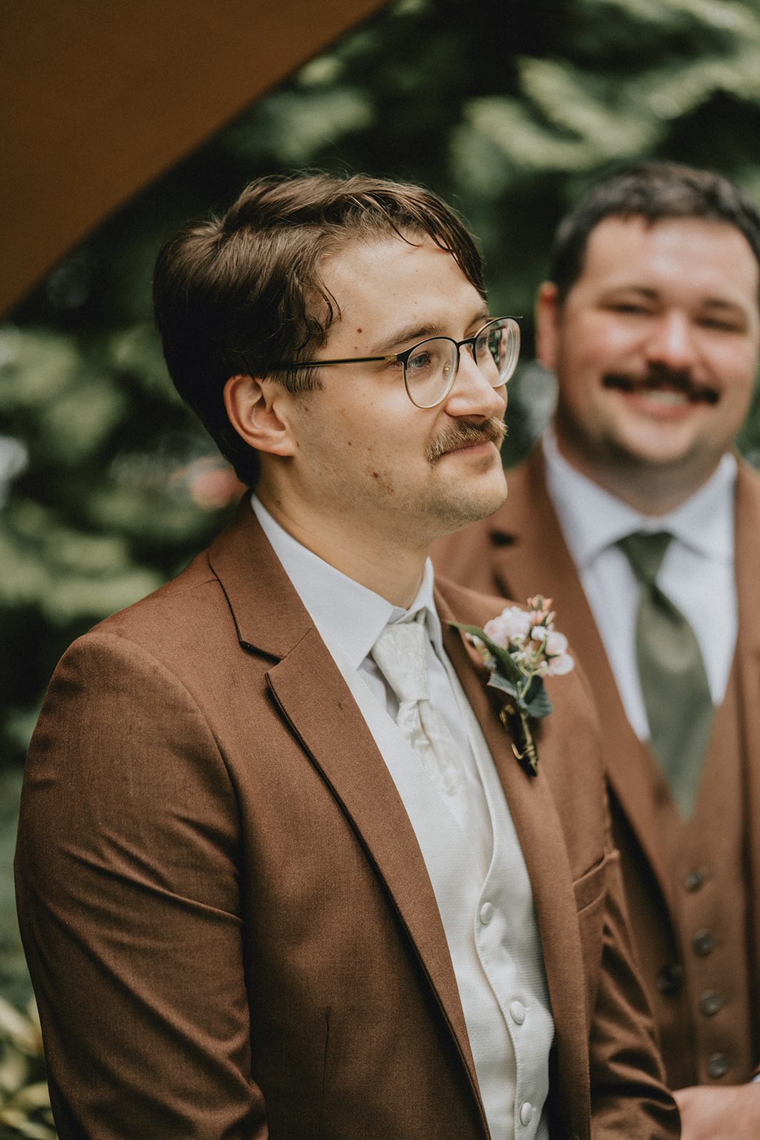 Groom watching his bride arrive