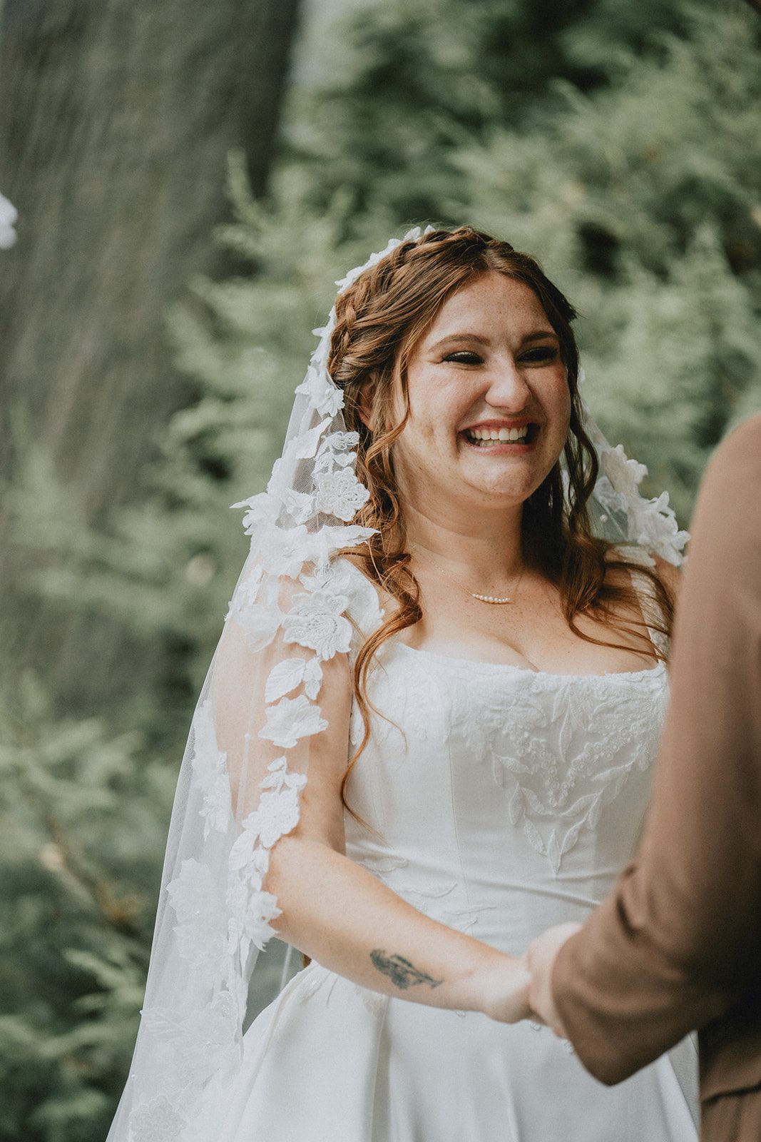 Bride smiling during the vows