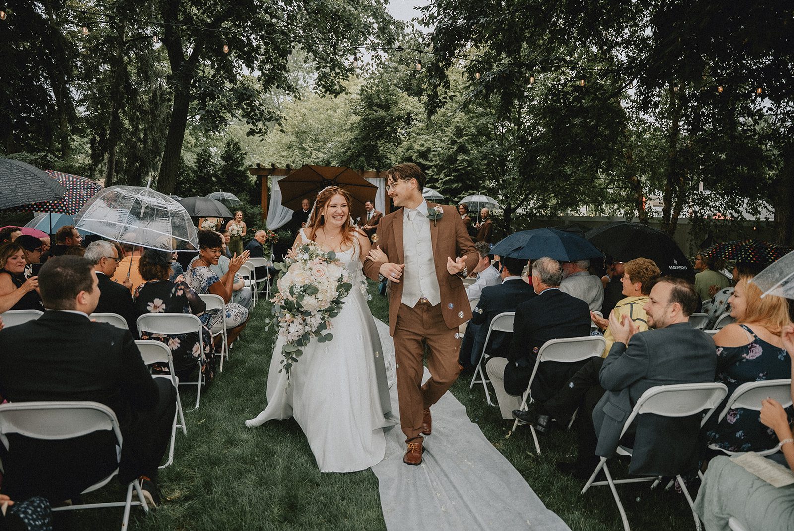 Newlyweds walking back up the aisle