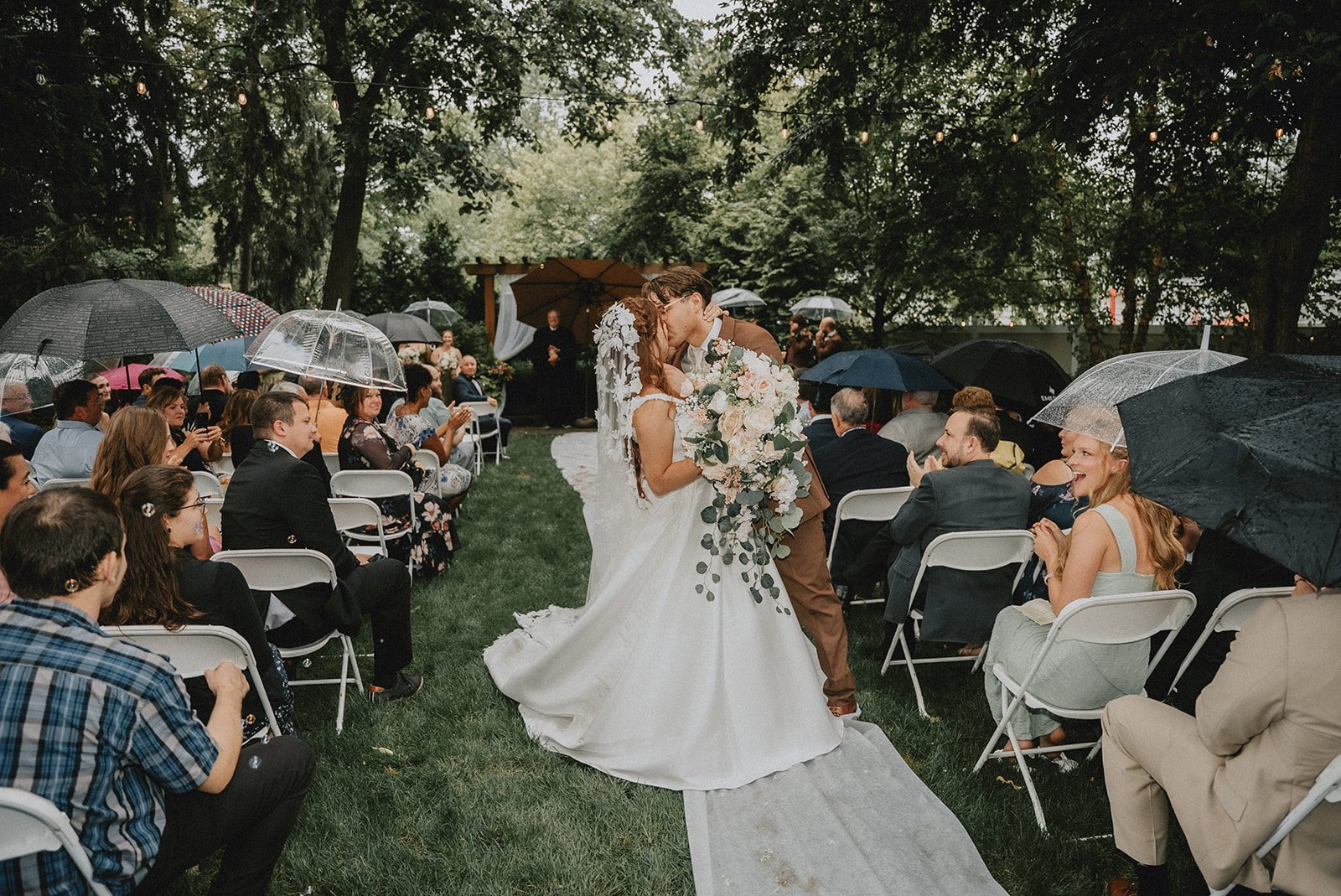 Guests cheering for the newlyweds