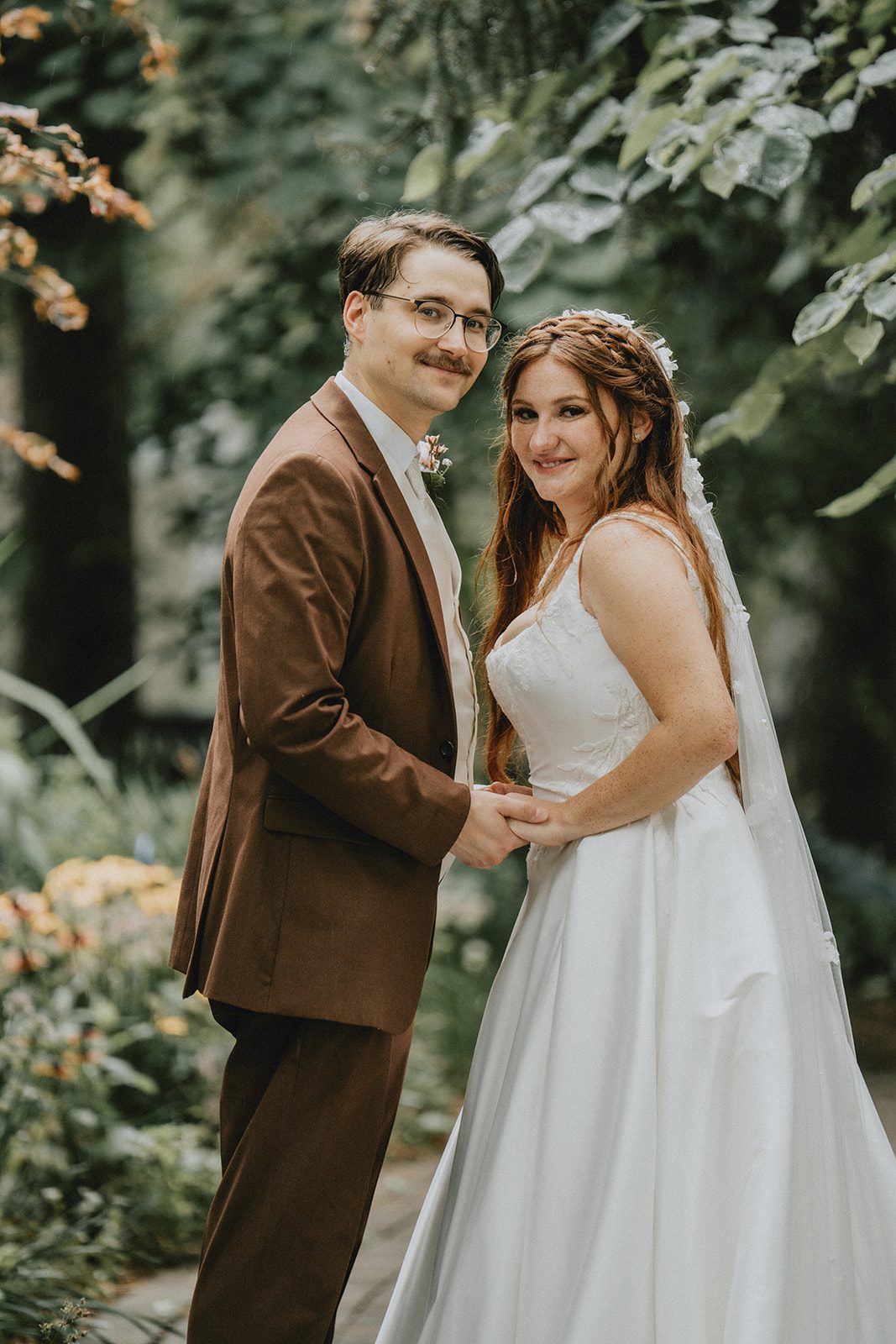 Bride and groom holding each other close