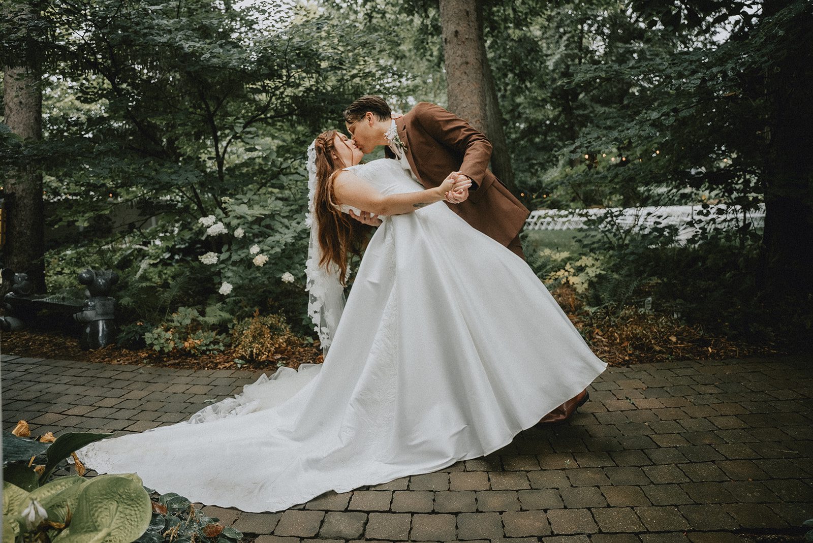 Bride's gown flowing in the garden