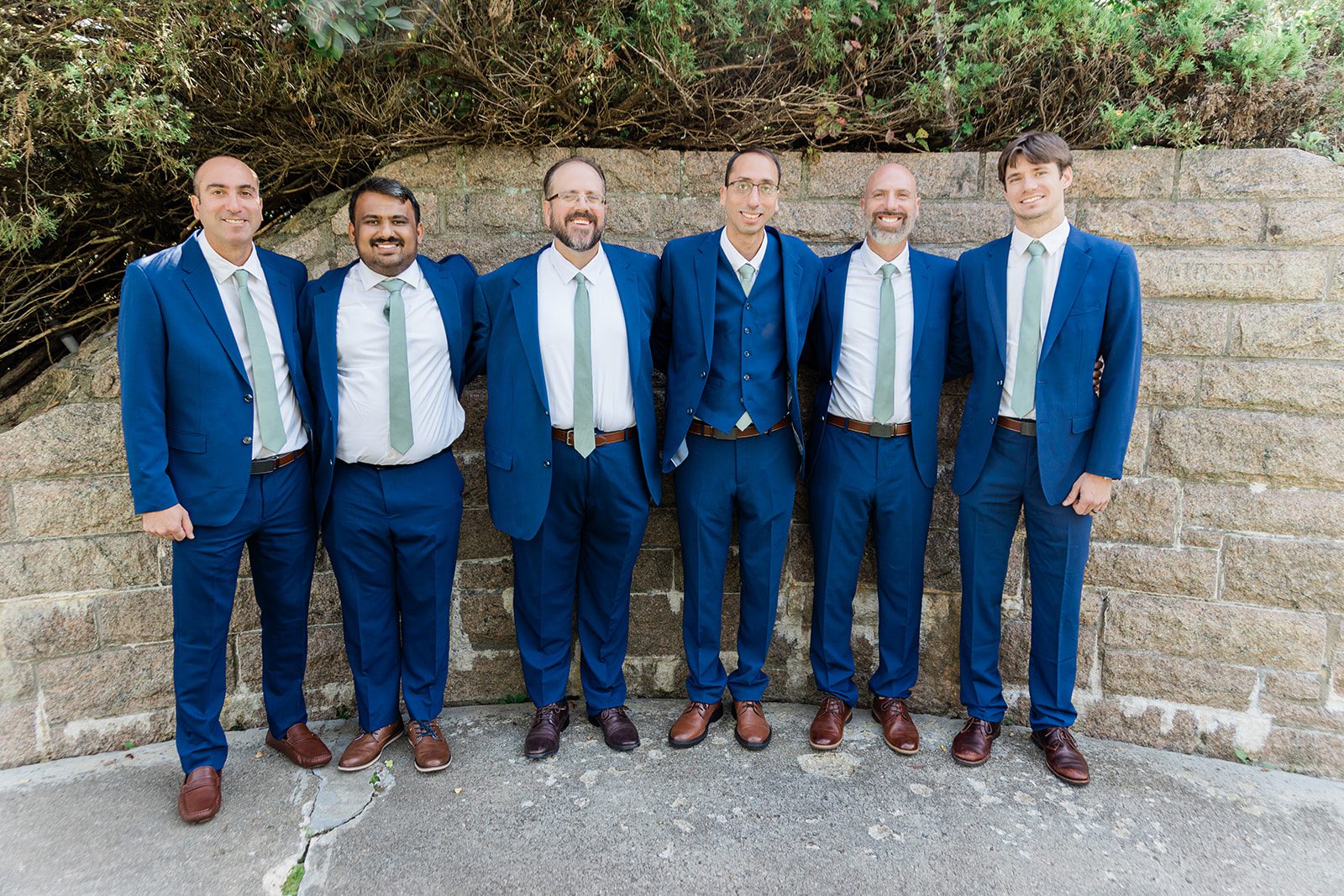 Groom with his groomsmen in blue suits Groom with his groomsmen in blue suits