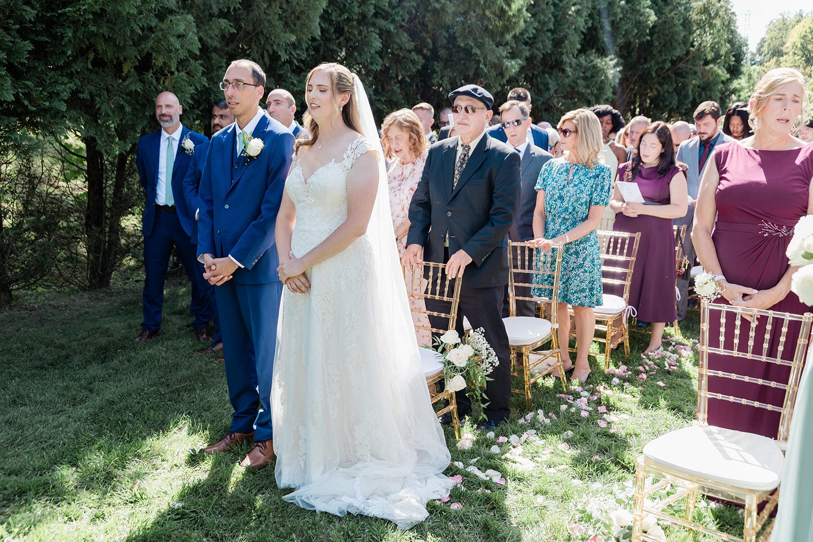 Couple at the ceremony with the officiant Couple at the ceremony with the officiant