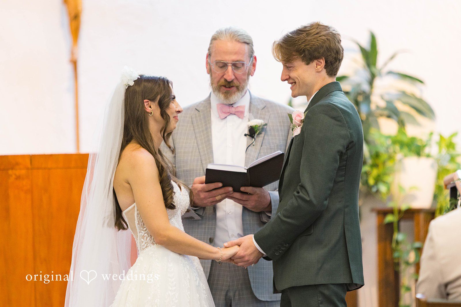 Couple exchanging vows with the officiant
