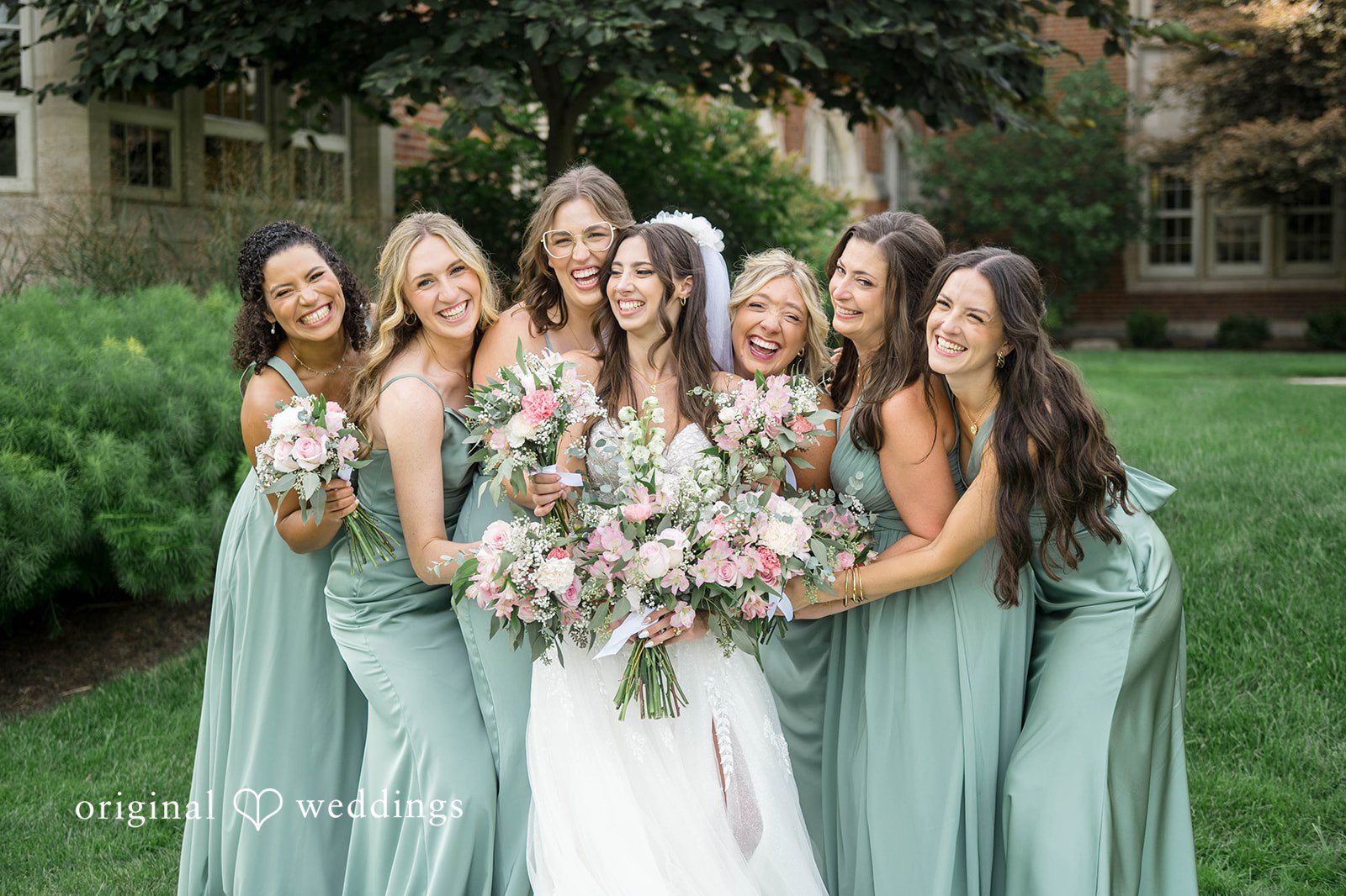 Bride with her bridesmaids holding bouquets at Tremont Cityside Ballroom