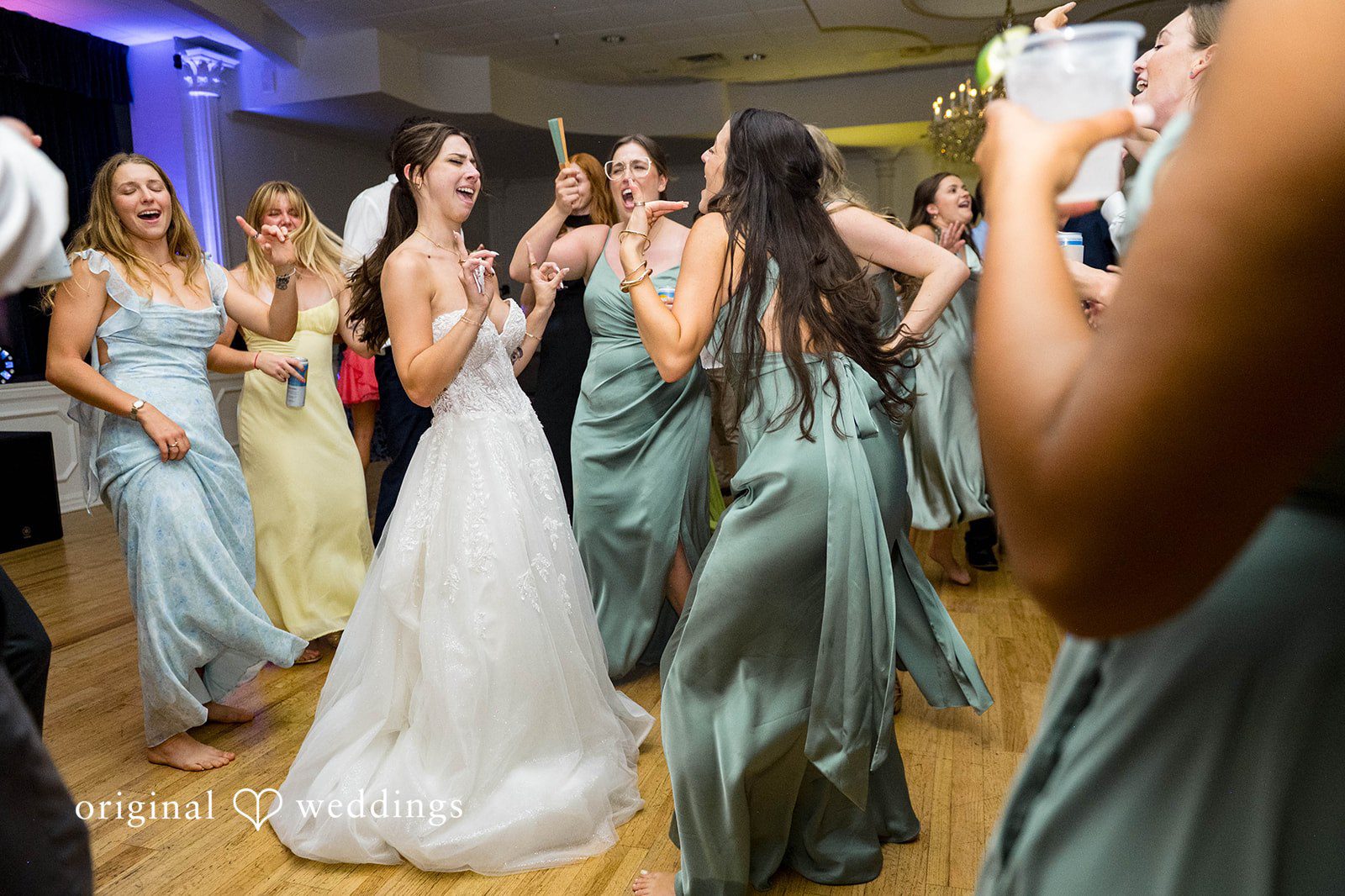 Bride dancing with her bridesmaids
