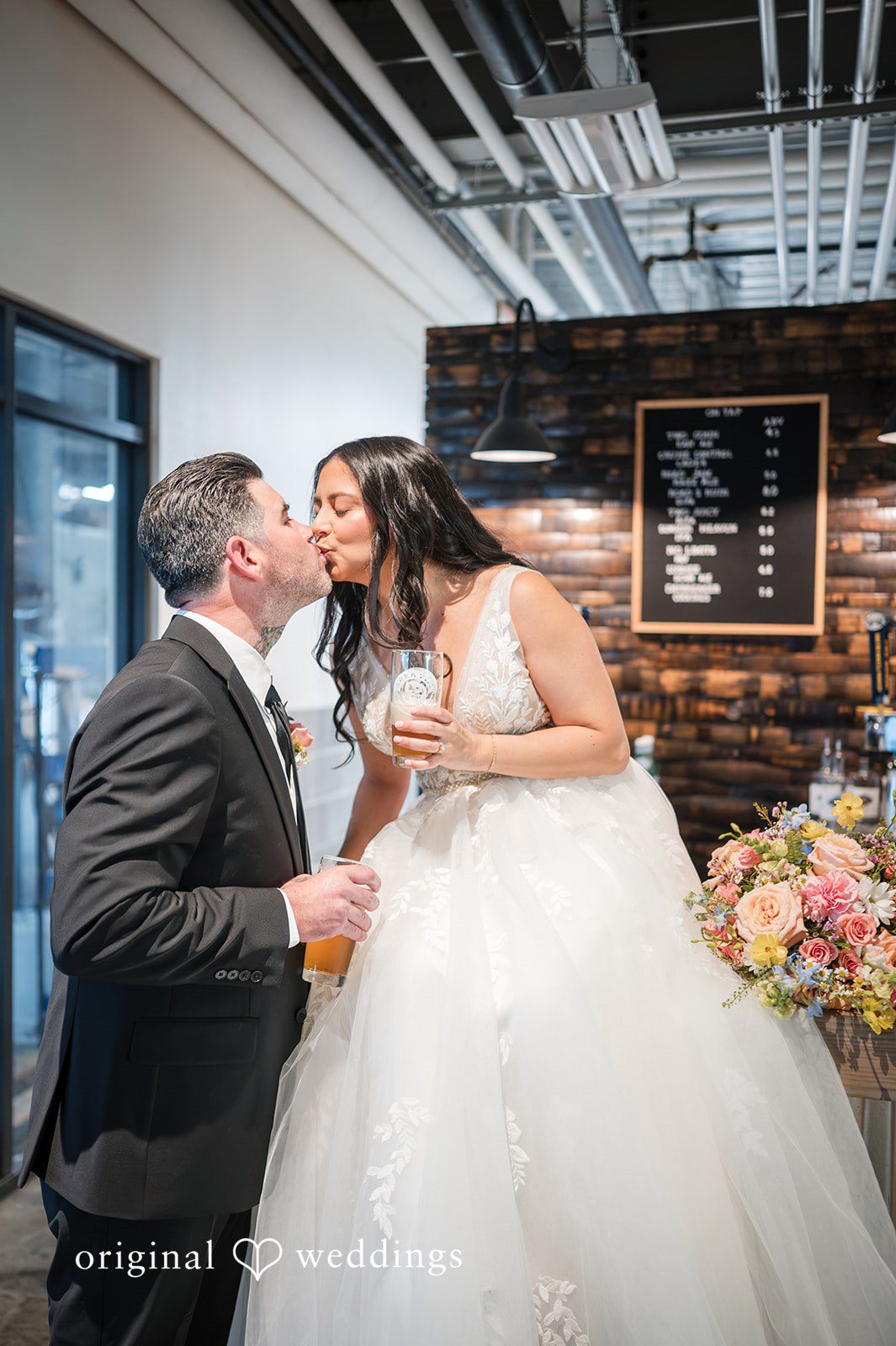 The couple shares a kiss
