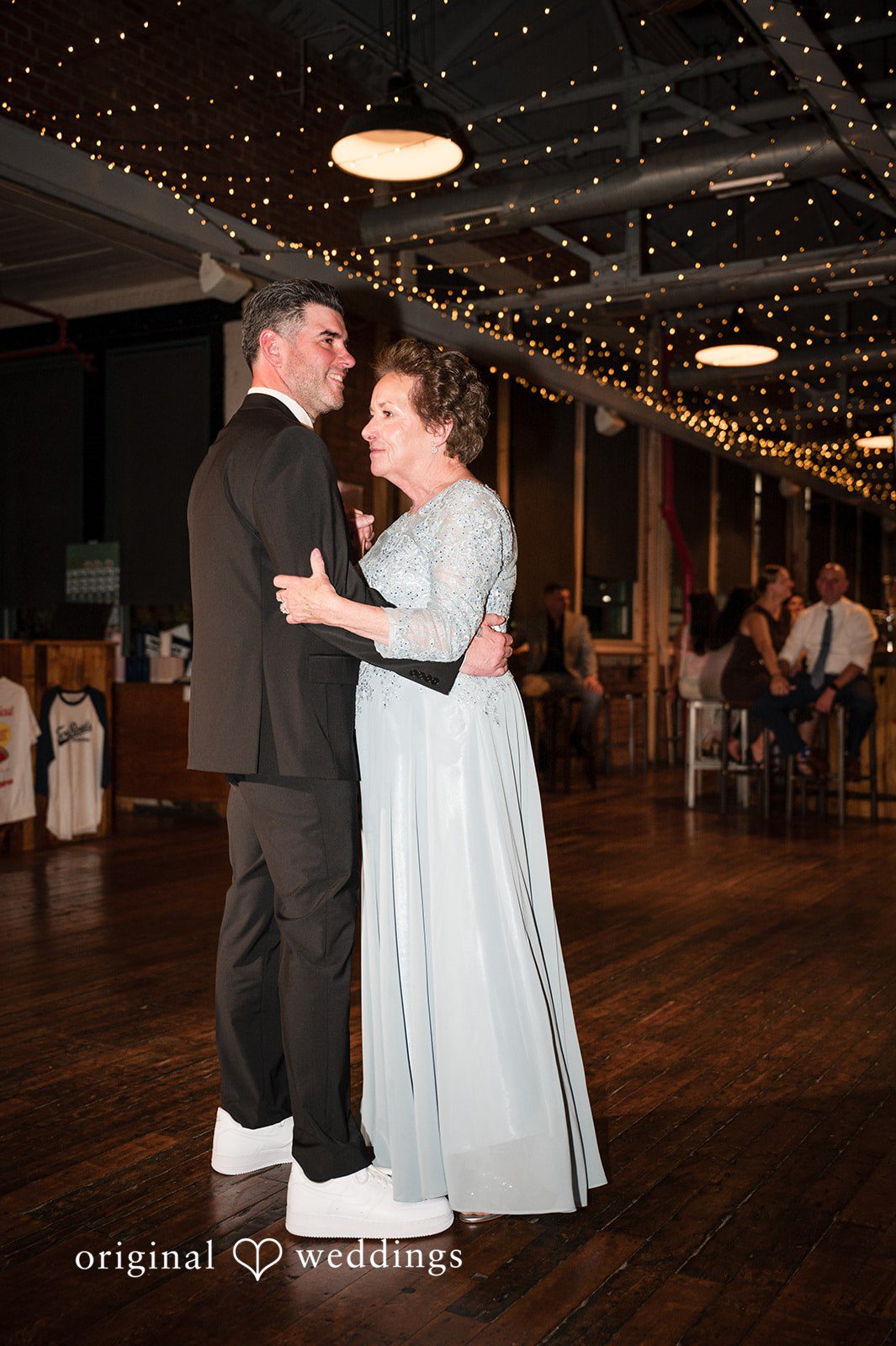 The groom dances with his mother