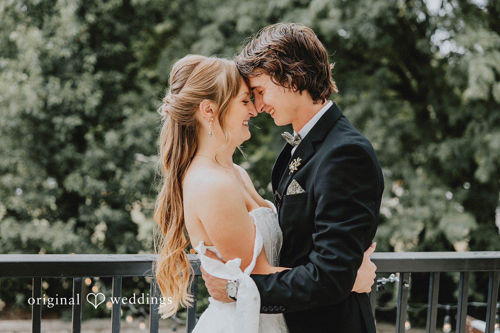 Grace + Andre Bride and groom touching foreheads under the trees