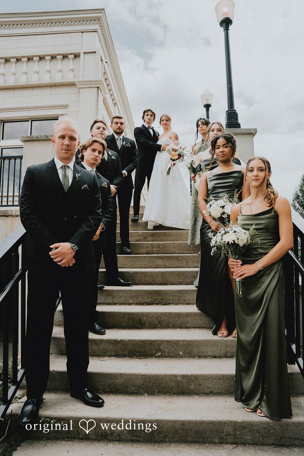 Grace + Andre Bride and groom posing on an outdoor staircase at Veterans Terrace