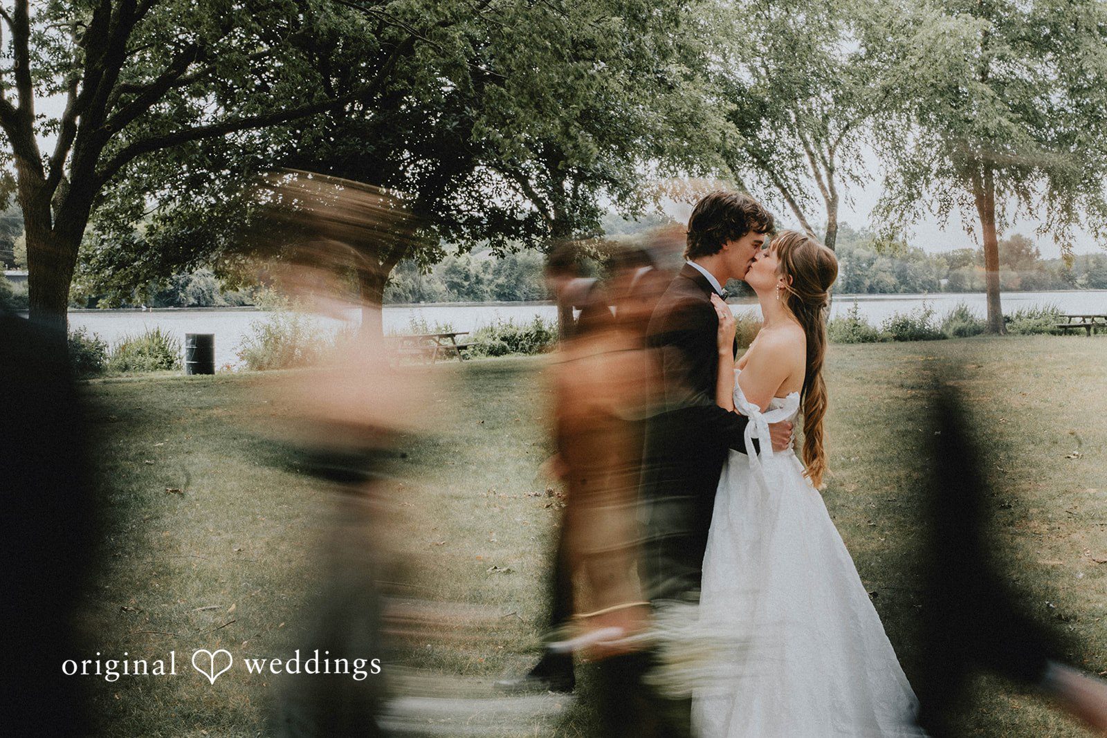 Grace + Andre Bride and groom standing still as guests move around them