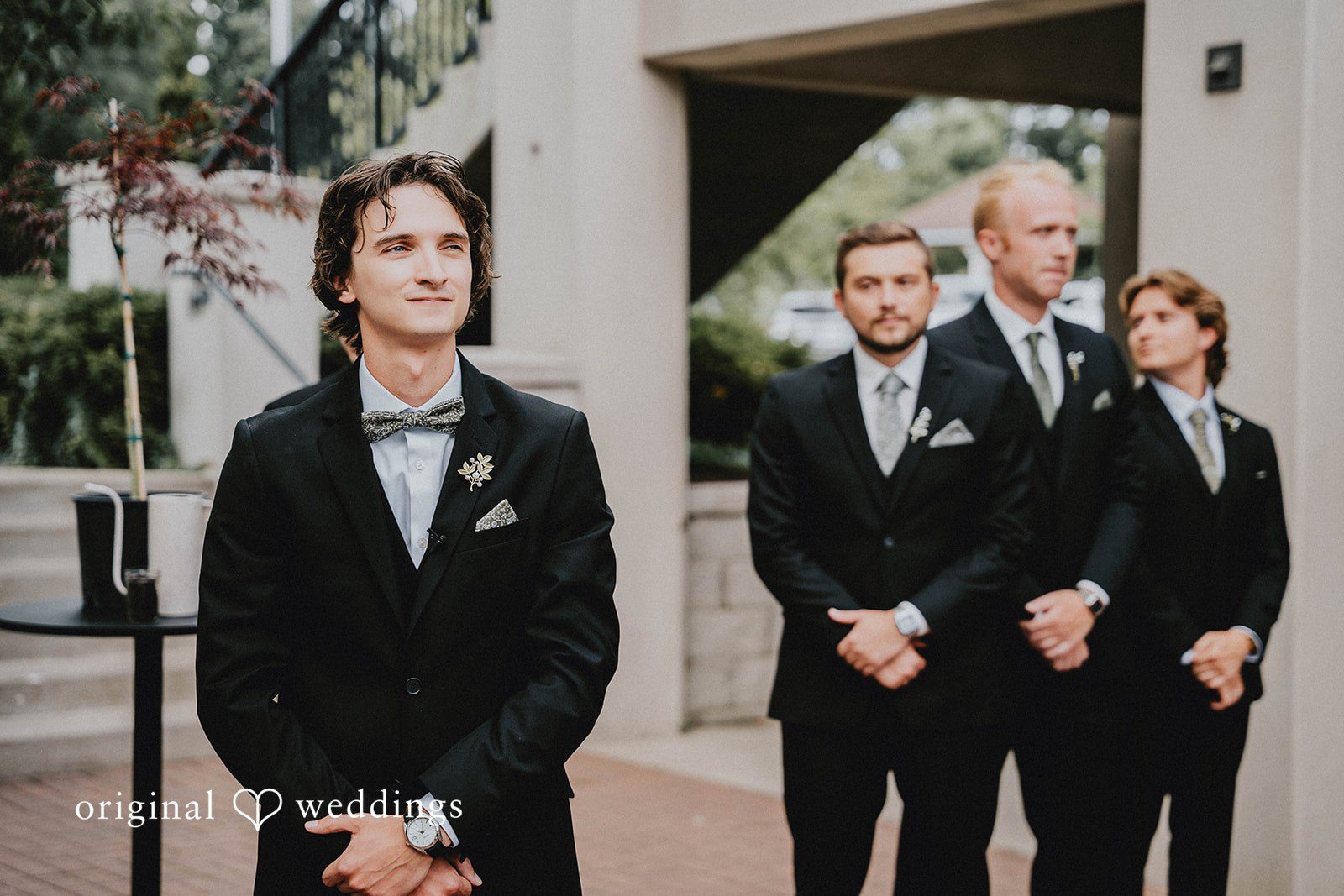 Grace + Andre Groom laughing with his groomsmen