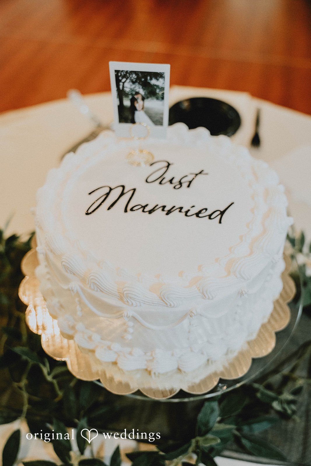 Grace + Andre Wedding cake topped with a Just Married sign at Veterans Terrace