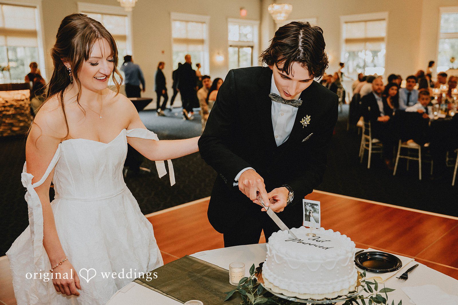 Grace + Andre Bride and groom cutting their wedding cake