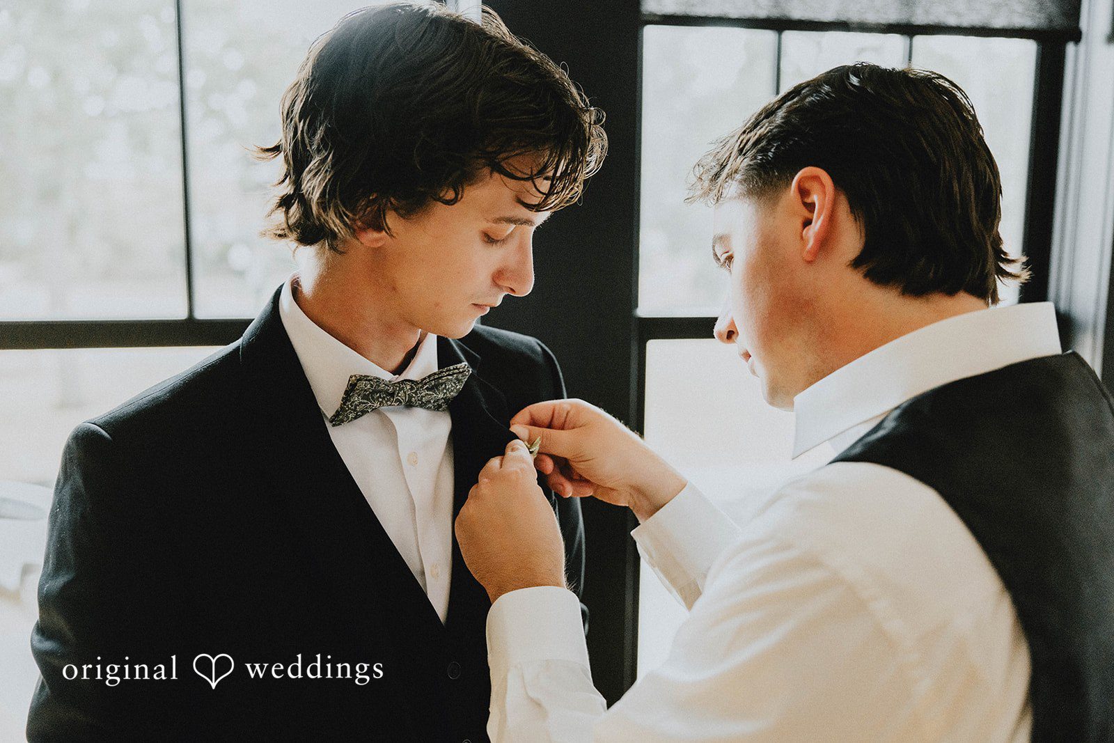 Grace + Andre Groom getting his boutonniere pinned on