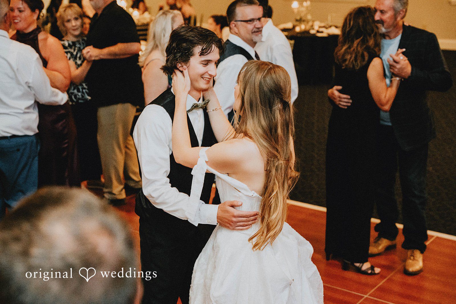 Grace + Andre Bride and groom on a crowded dance floor with their guests