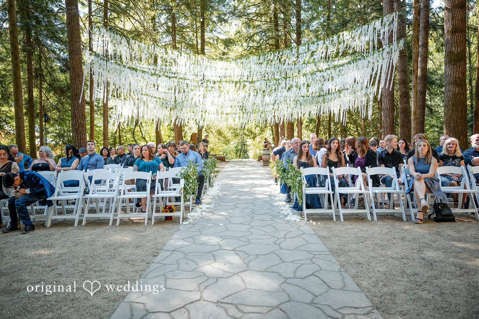 Kylie + Reymundo Forest ceremony site with white chairs at Victorian Vineyard