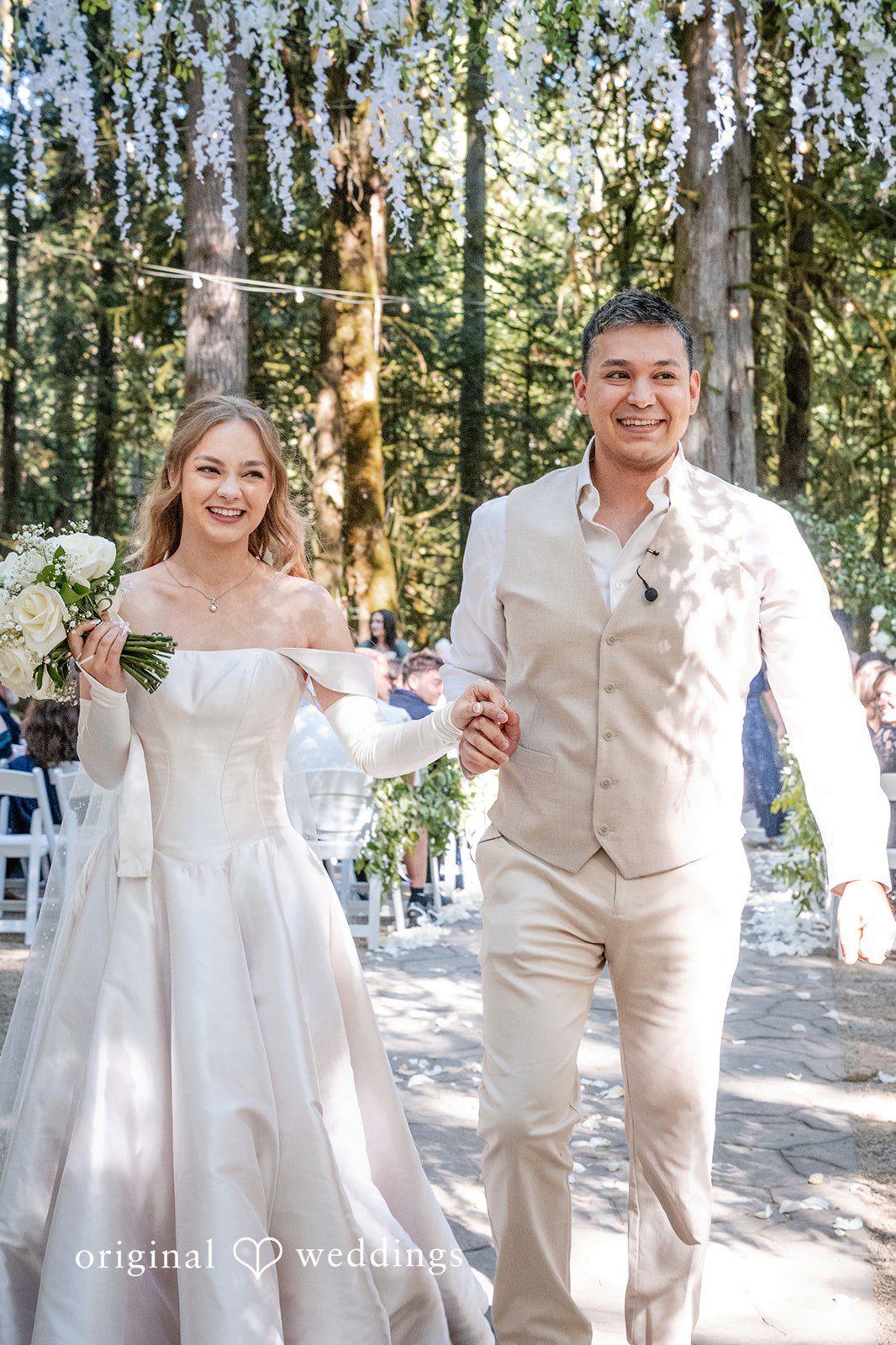 Kylie + Reymundo Bride and groom walking through the trees, captured by Portland wedding photographers from Original Weddings