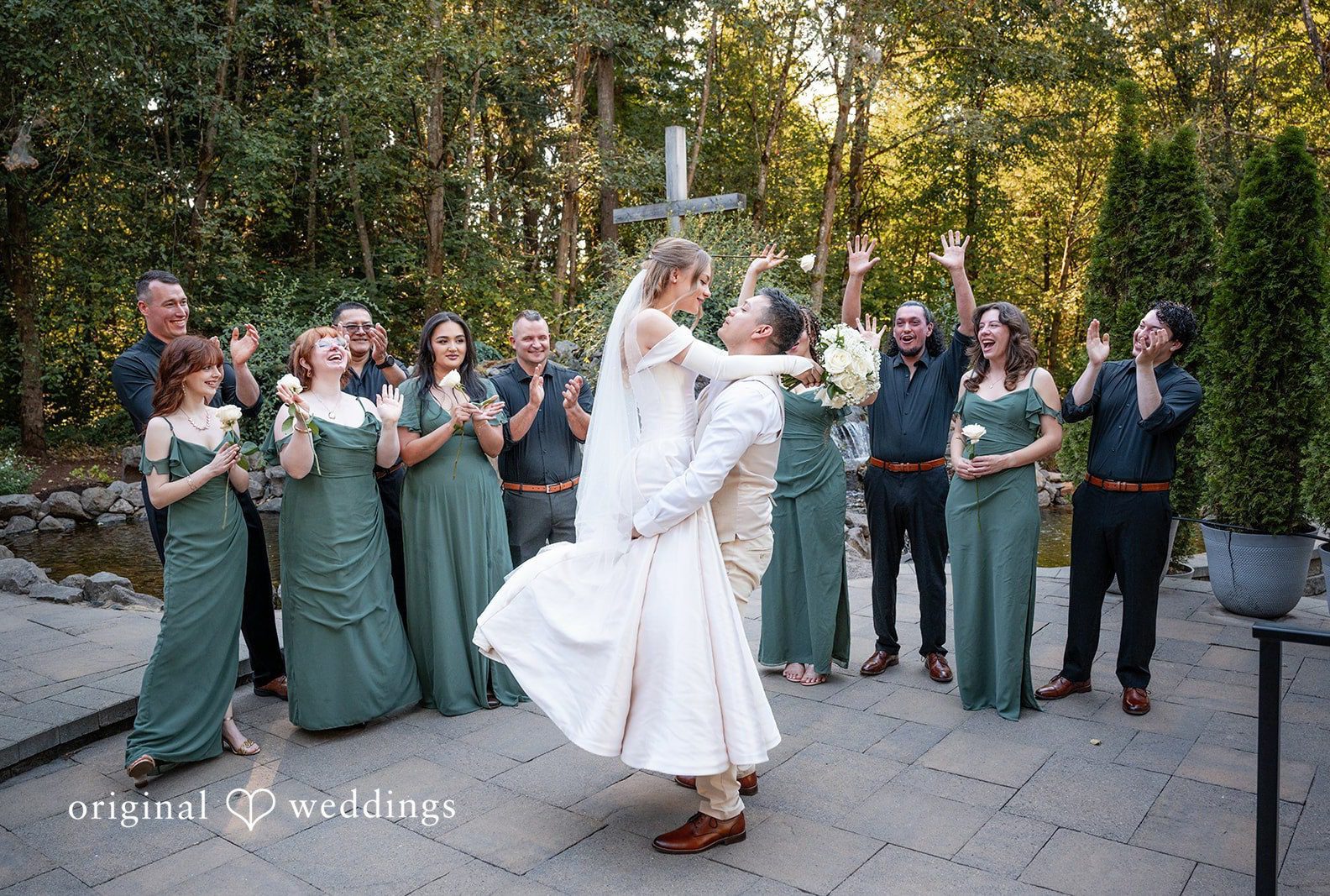 Wedding party cheering as Kylie and Reymundo dance on the patio, captured by Portland wedding photographers from Original Weddings at Victorian Vineyard