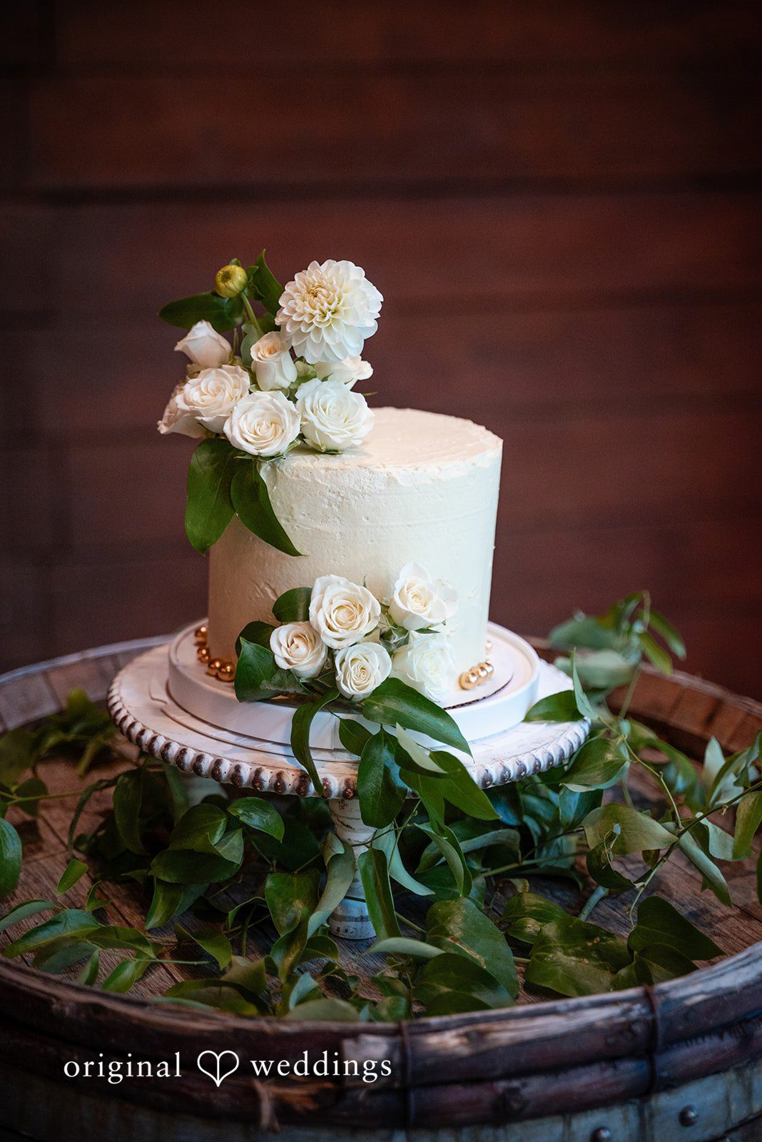 Kylie + Reymundo White wedding cake with greenery at Victorian Vineyard