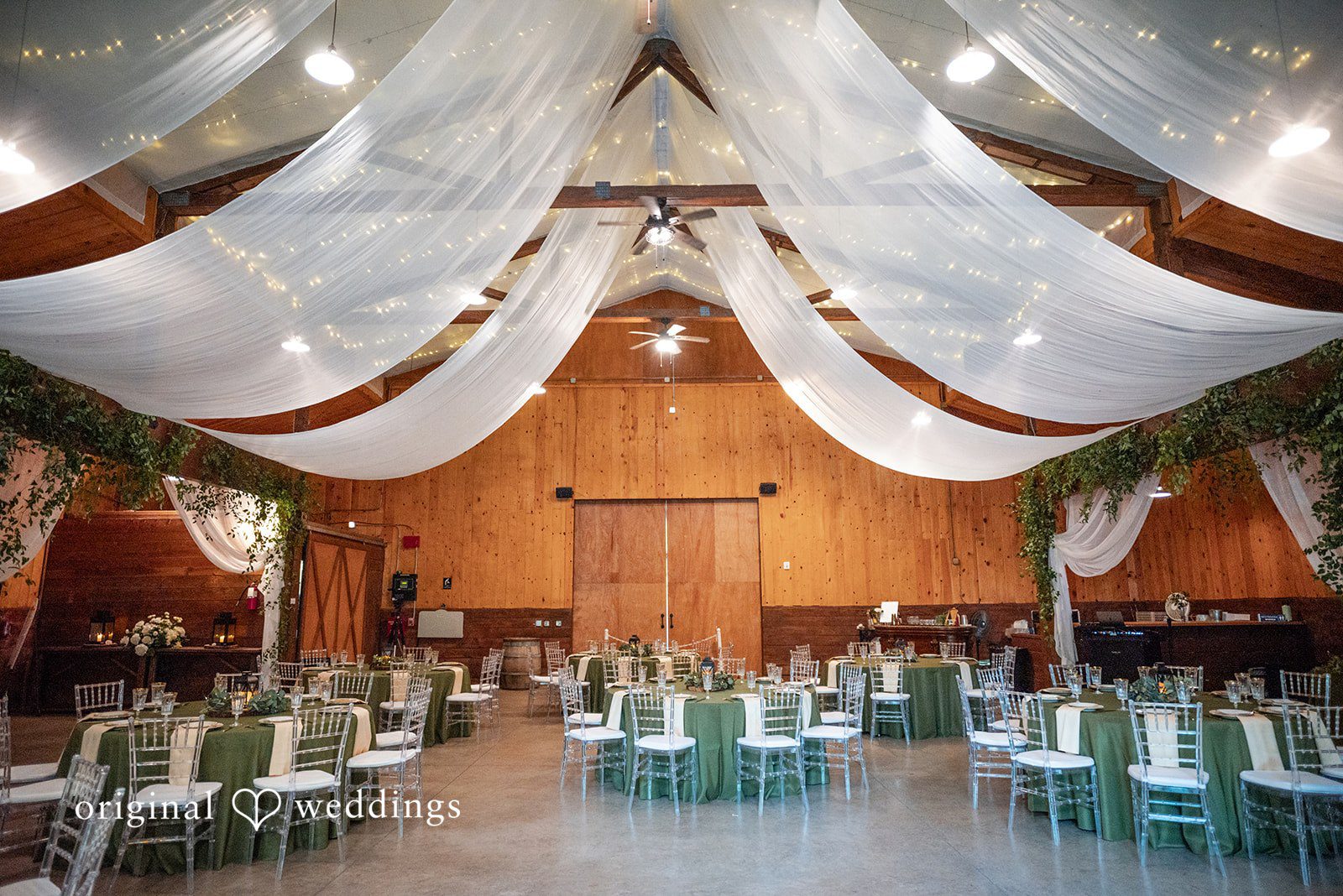 Kylie + Reymundo Reception hall draped in white fabric at Victorian Vineyard