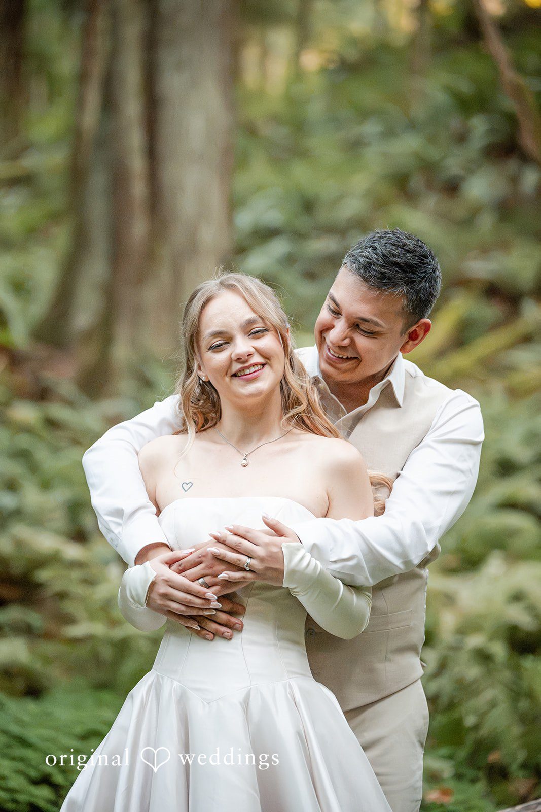 Kylie + Reymundo Couple embracing in the forest at Victorian Vineyard