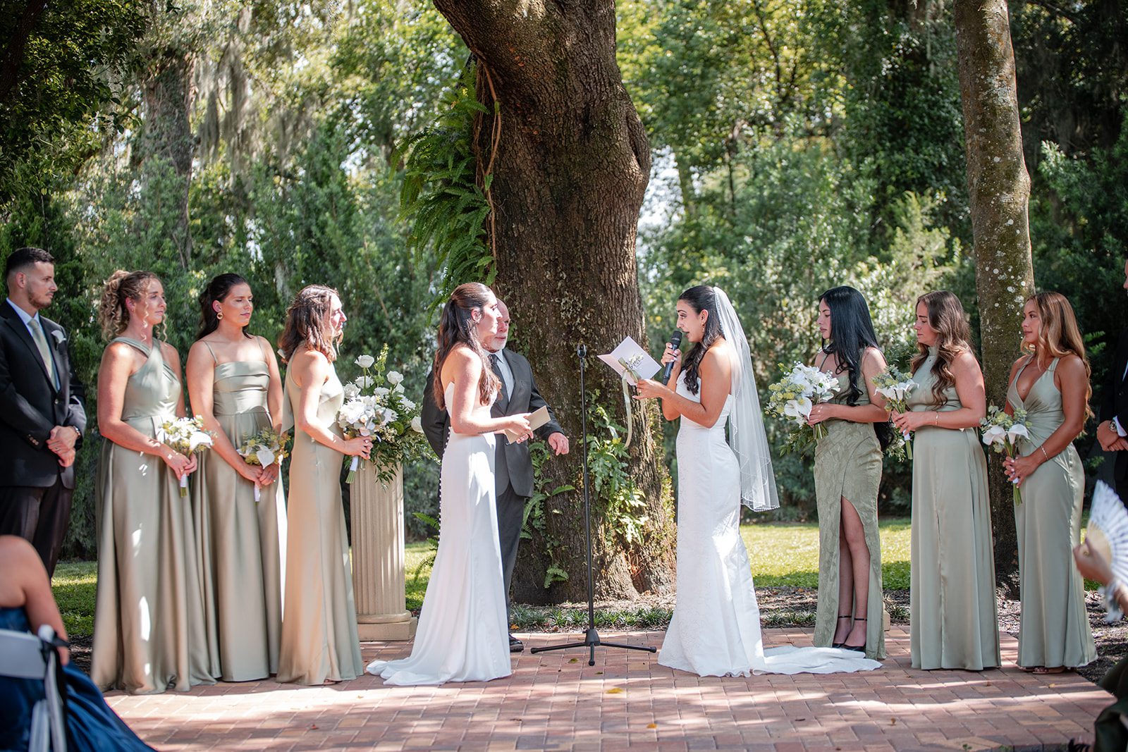villa-festa-timeless-orlando-alondra-madison-011-08 Brides at the ceremony under the oak at Villa Festa