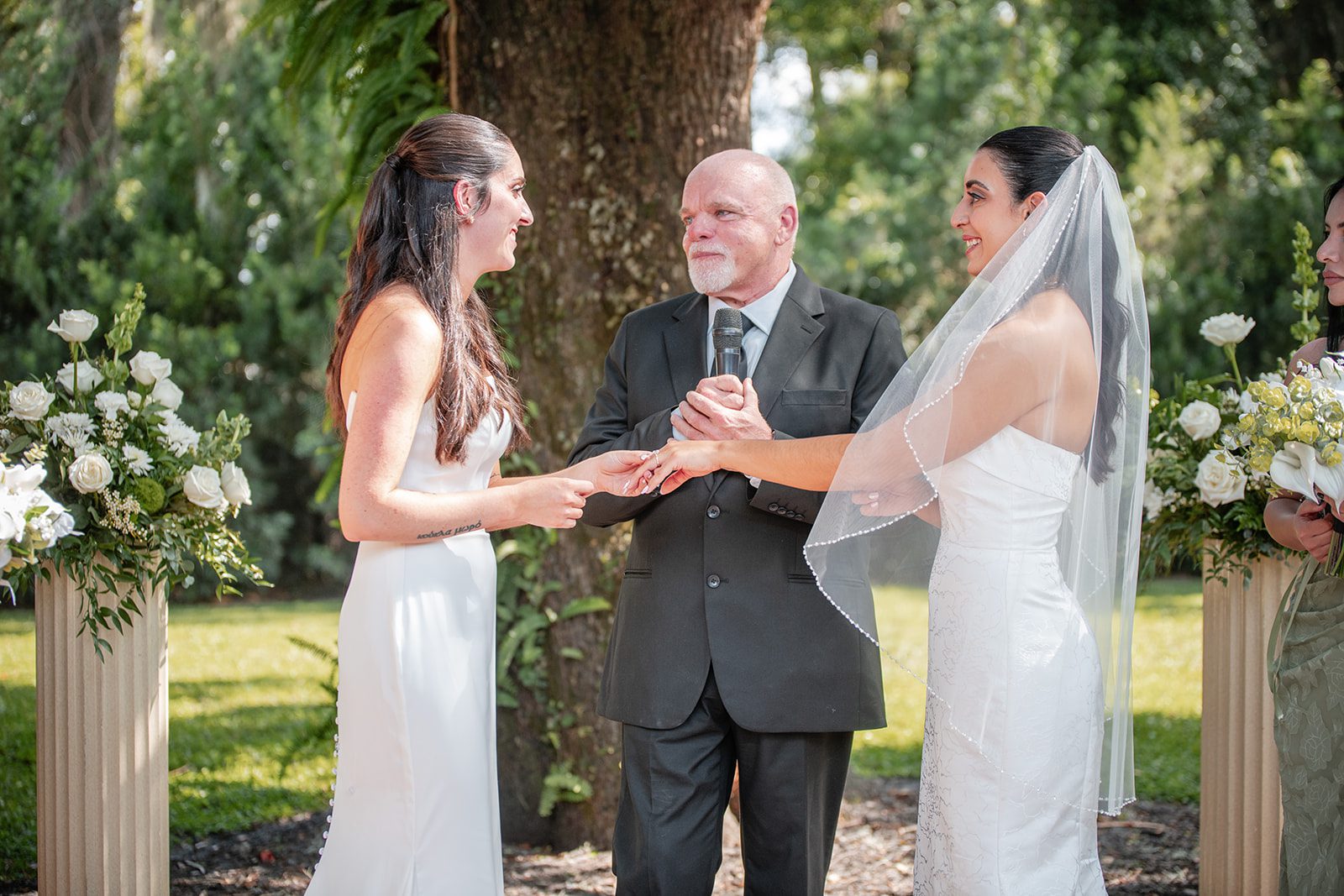 villa-festa-timeless-orlando-alondra-madison-013-21 Brides holding hands during the vows