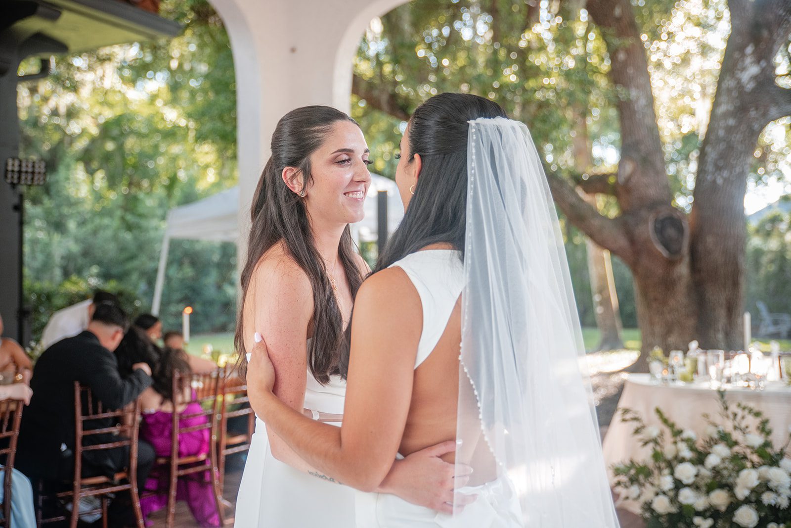 villa-festa-timeless-orlando-alondra-madison-031-35 Brides hugging during the reception