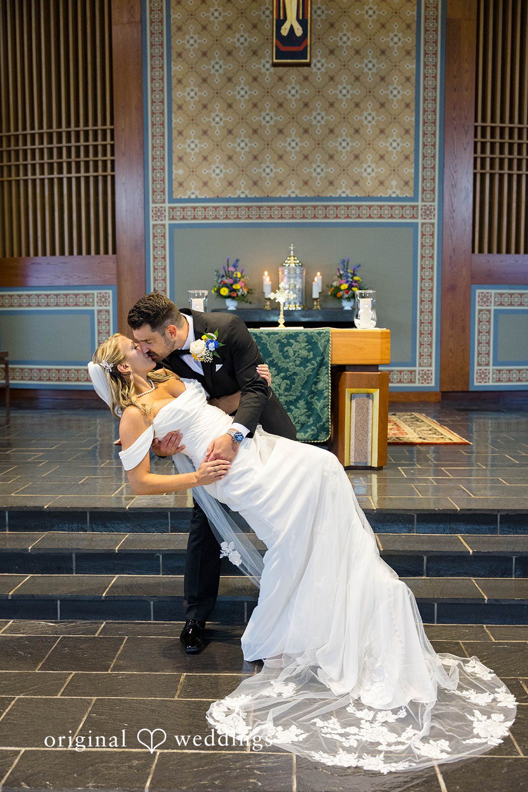 Groom dipping the bride at the altar after the ceremony