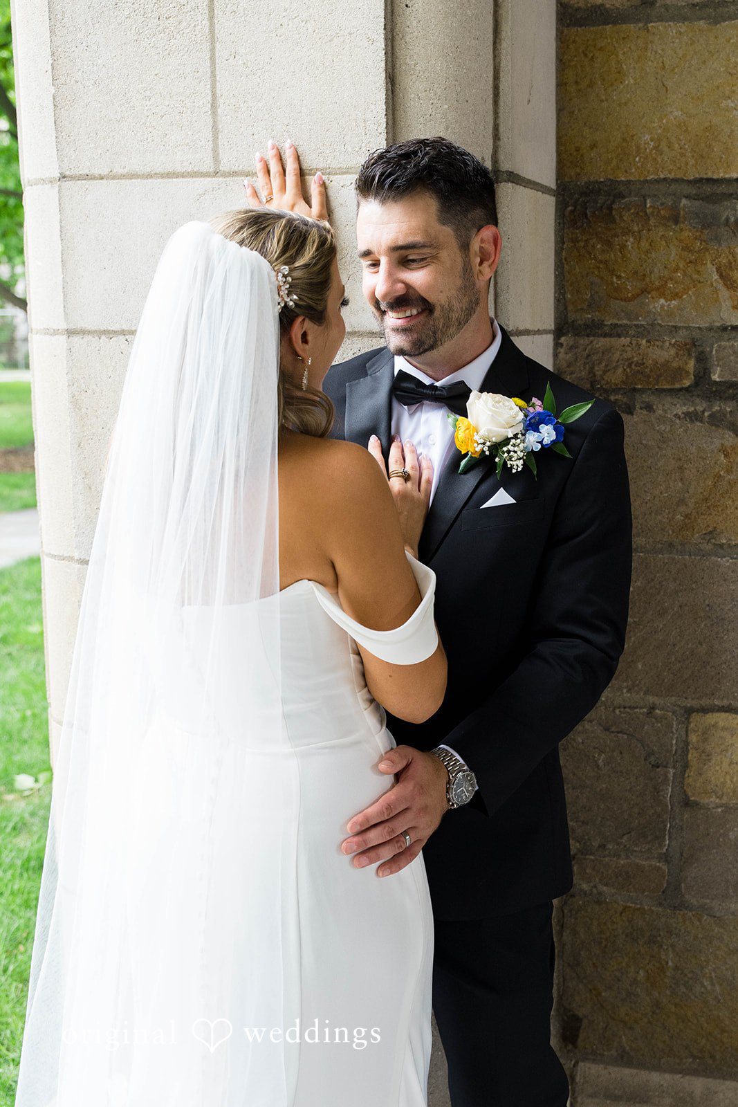 Bride resting on the groom's shoulder on their Vinology wedding day