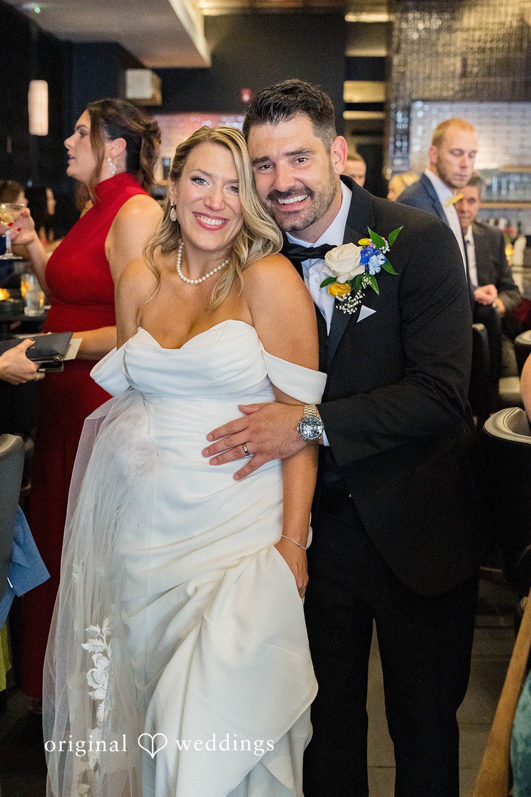 Andrew and Nicole smiling together at their Vinology wedding reception