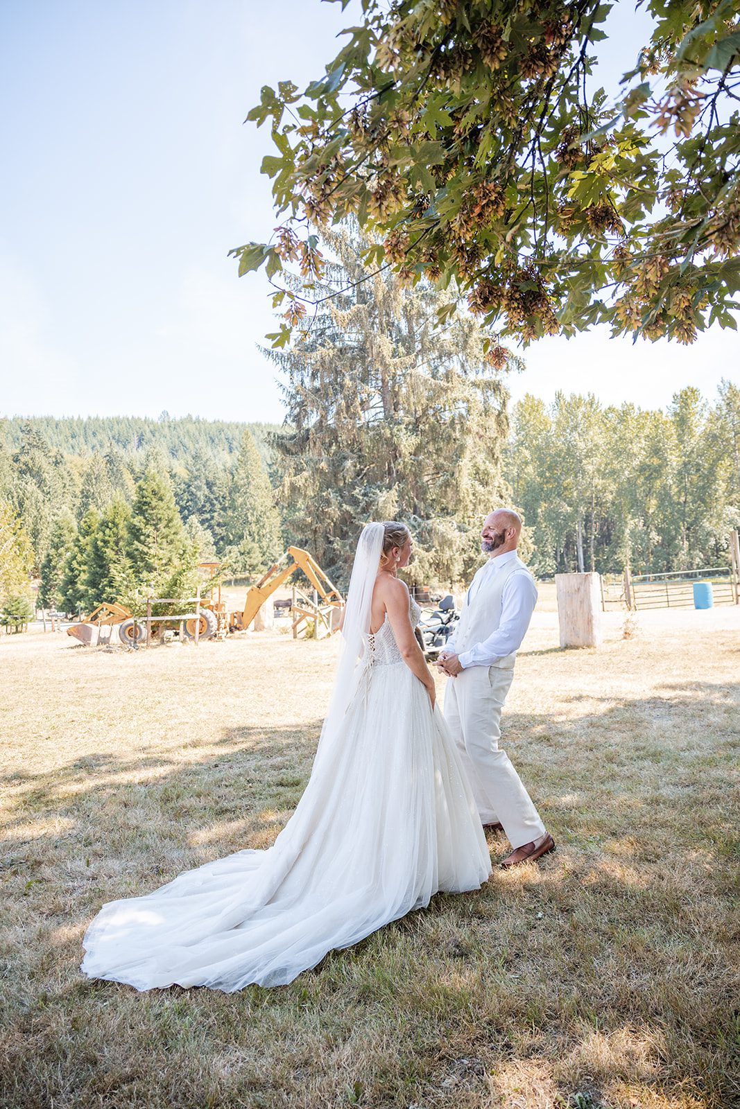 washington-backyard-timeless-seattle-beth-gunner-p005-05 Bride twirling her gown on the lawn