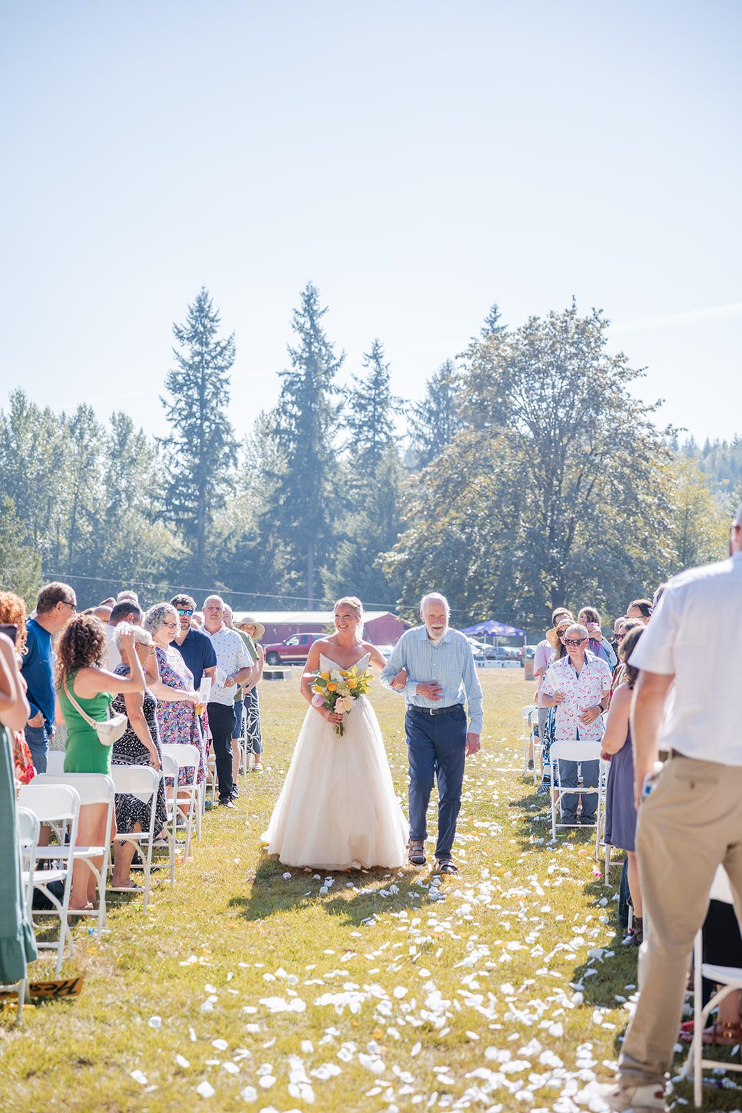 washington-backyard-timeless-seattle-beth-gunner-p008-22 Bride walking down the grassy aisle at a Washington backyard wedding