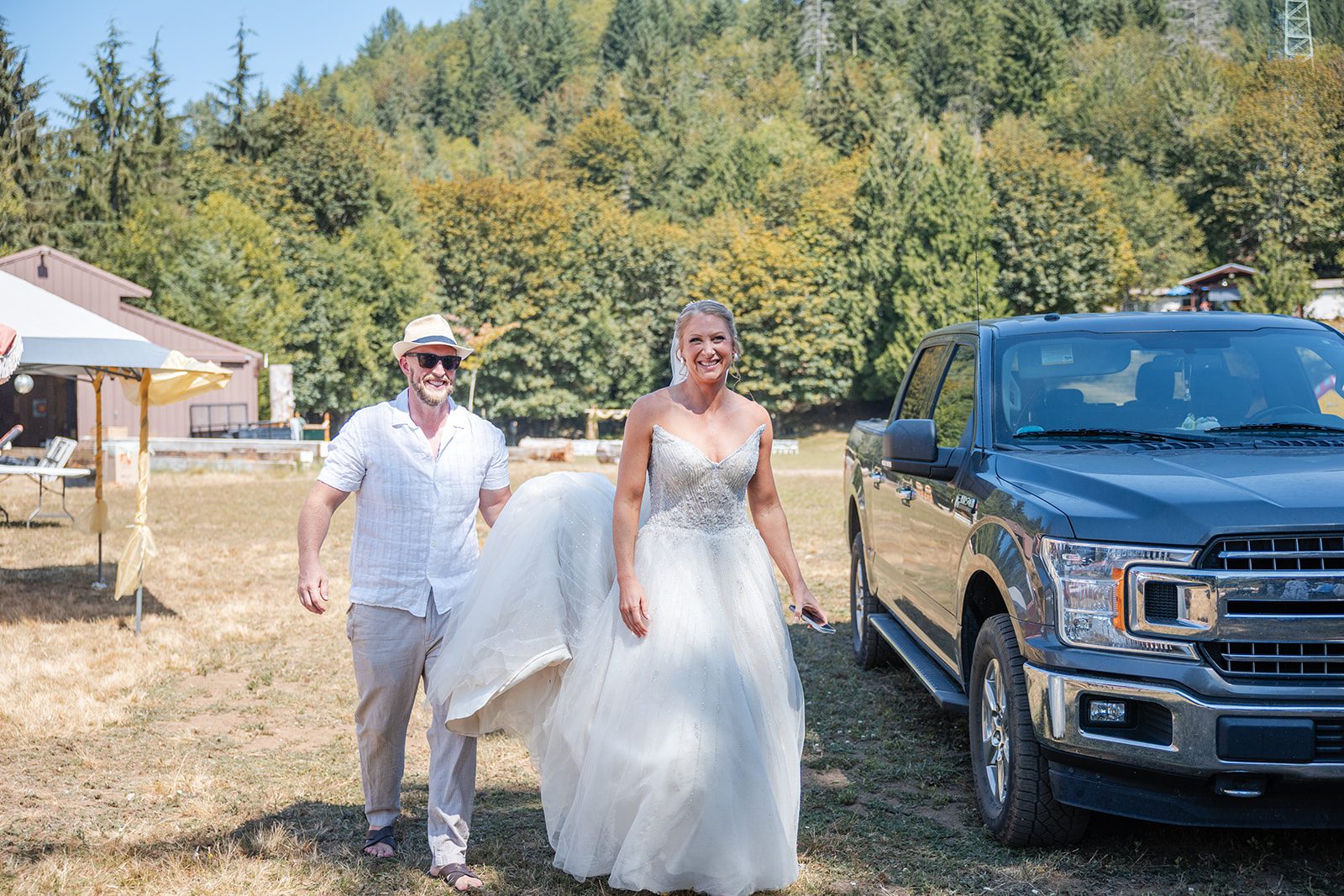 washington-backyard-timeless-seattle-beth-gunner-p015-09 Bride and groom laughing by a pickup truck
