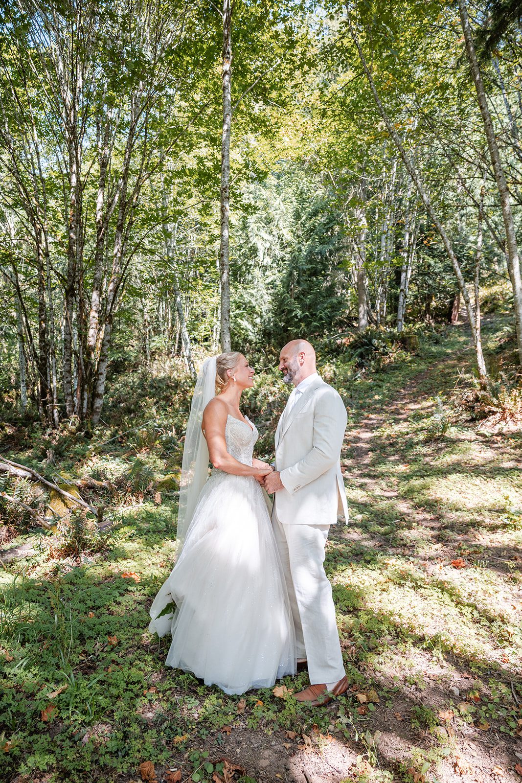 washington-backyard-timeless-seattle-beth-gunner-p016-18 Couple standing in the forest at a Washington backyard wedding