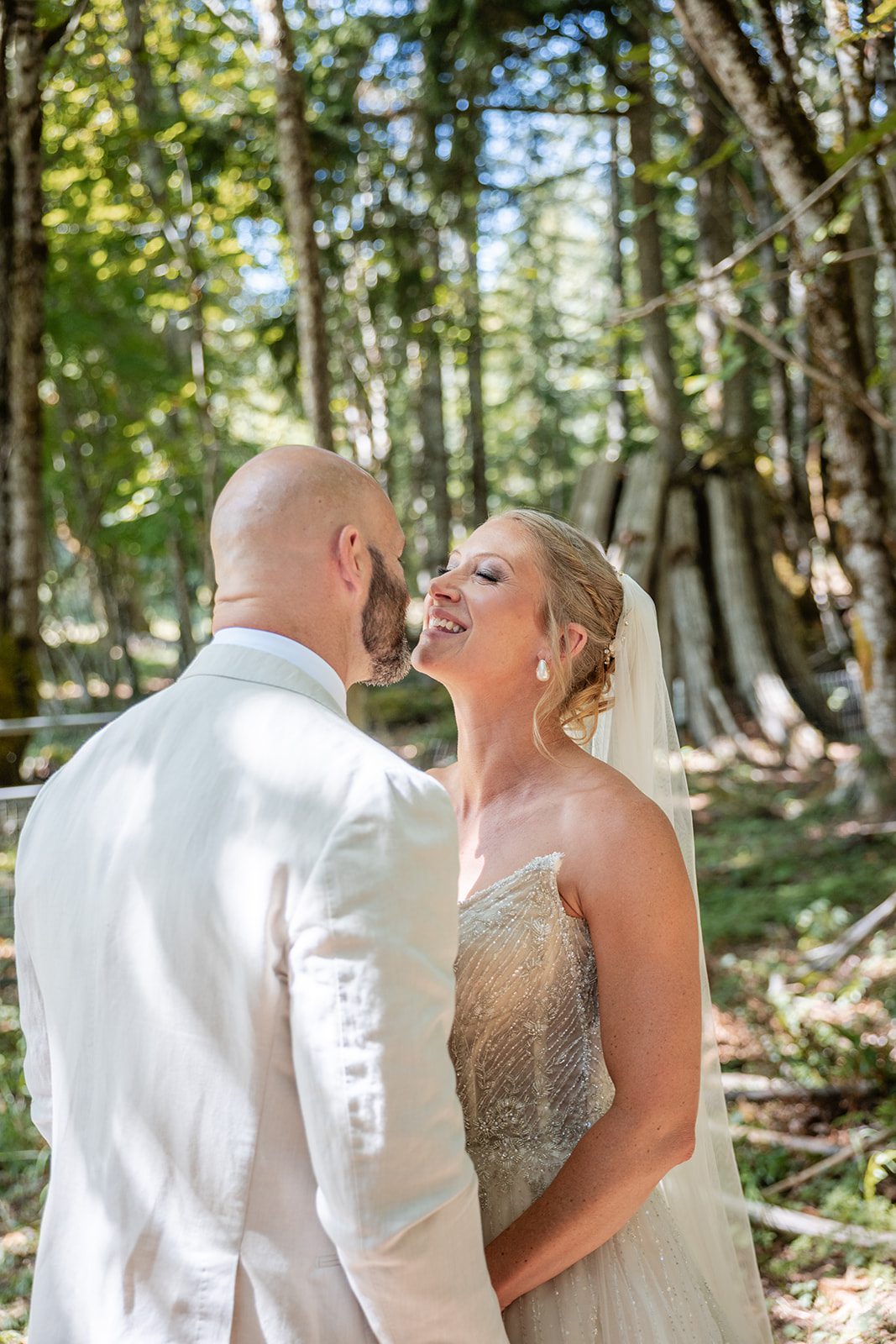 washington-backyard-timeless-seattle-beth-gunner-p017-24 Groom kissing the bride in the trees