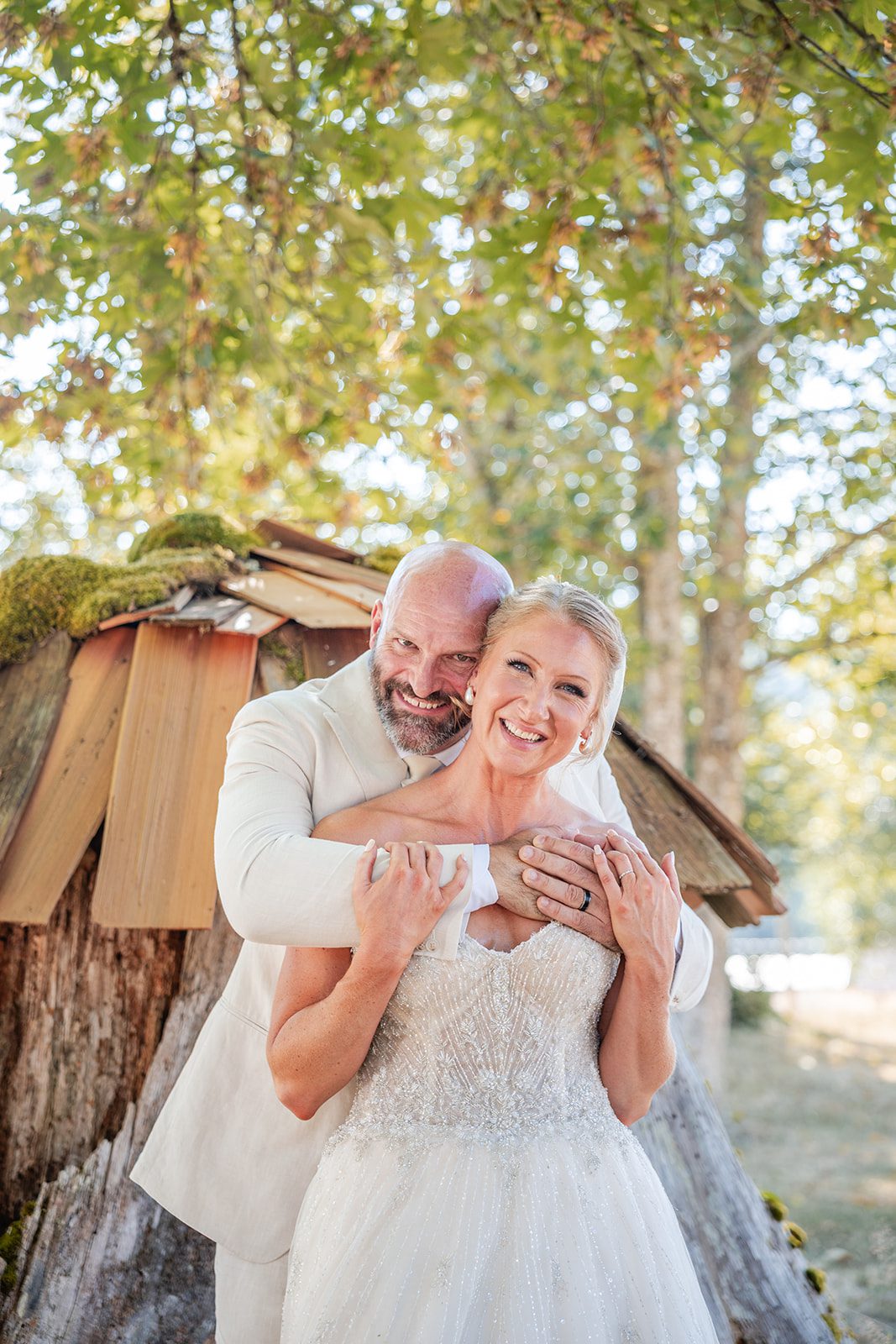 washington-backyard-timeless-seattle-beth-gunner-p021-03 Groom hugging the bride by the old shed