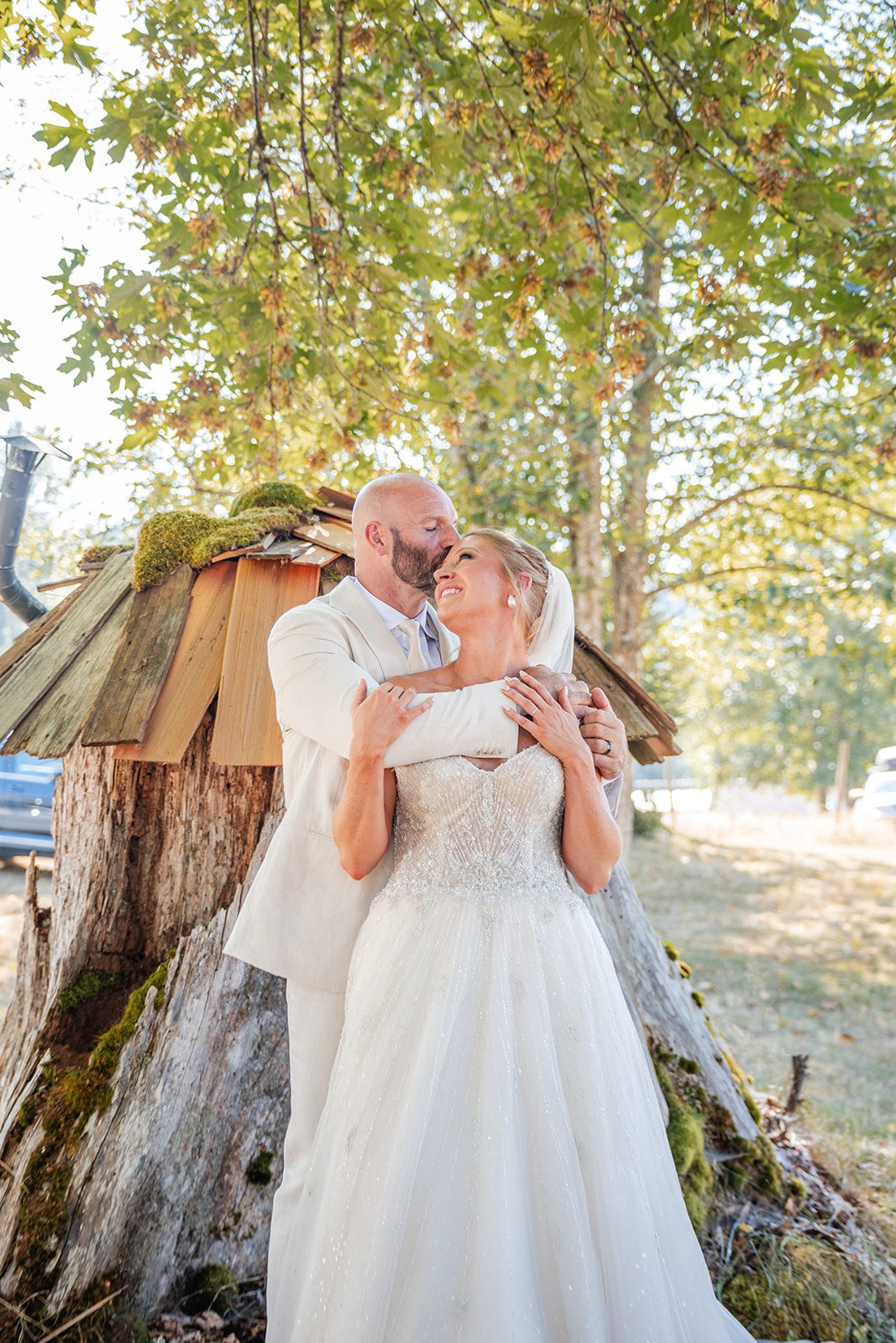 washington-backyard-timeless-seattle-beth-gunner-p022-27 Bride and groom smiling by the shed at a Washington backyard wedding