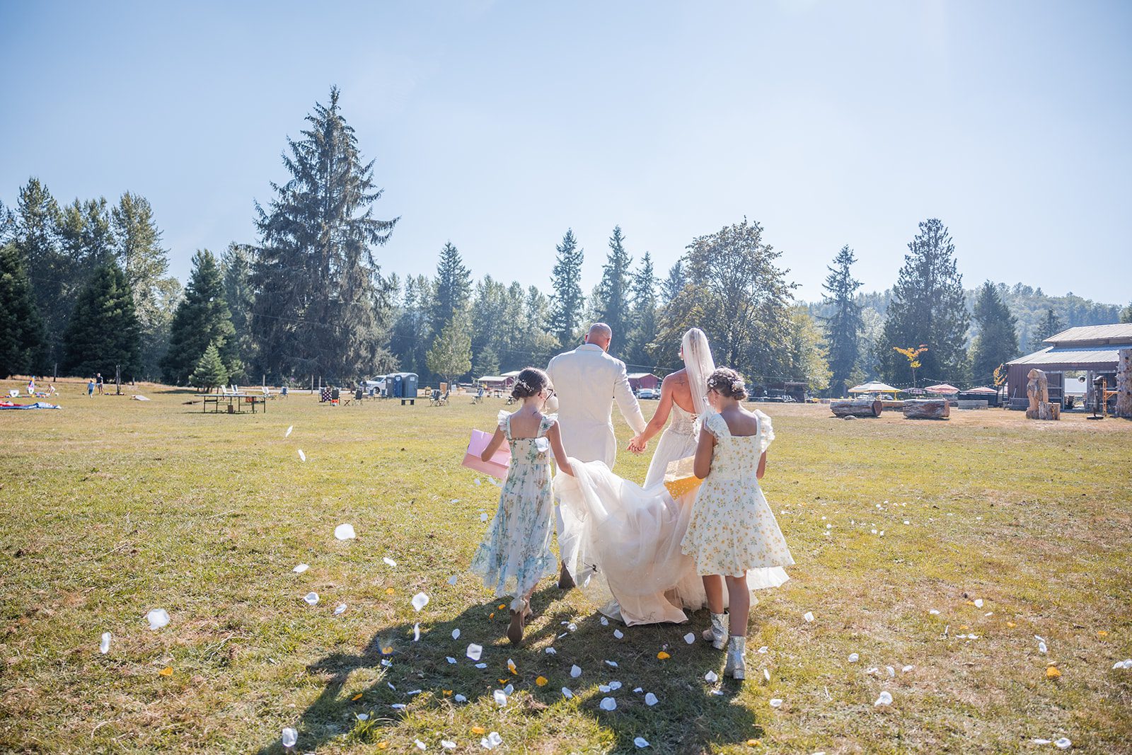 washington-backyard-timeless-seattle-beth-gunner-p024-16 Kids playing in the field during the party at a Washington backyard wedding