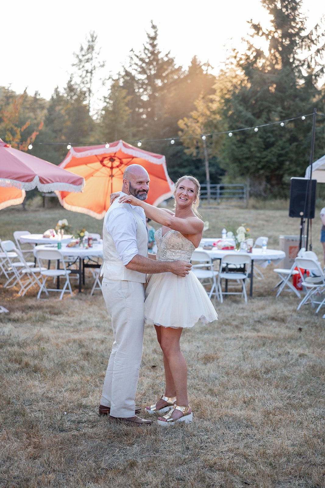 washington-backyard-timeless-seattle-beth-gunner-p027-07 Newlyweds dancing with guests