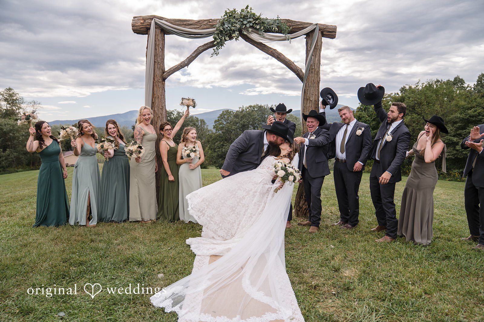 Shelby + Eli A romantic shot of the couple with cheers from their bridal party