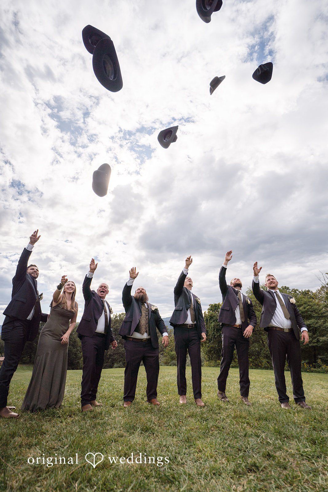 Shelby + Eli Hats tossed in the air
