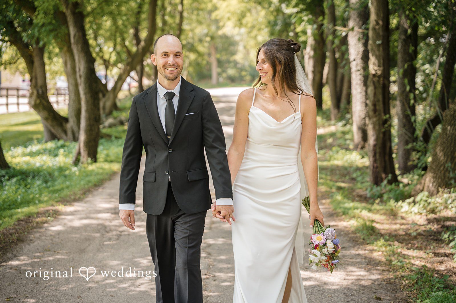 Becca and Kyle’s wedding portrait at Waukesha County Courthouse captured by Milwaukee wedding photographers.